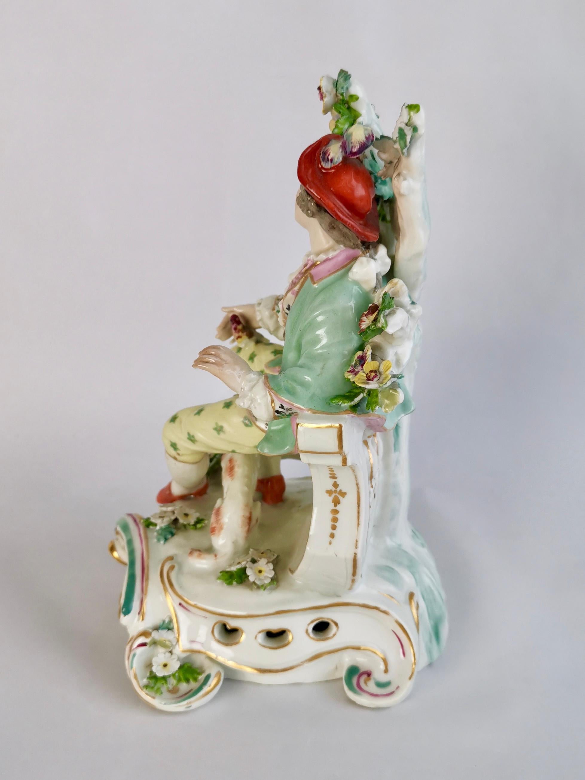 This is a beautiful figure of a gentleman with a dog and a bird, made by Edme Samson in Paris in the Derby style. 

Edme Samson was founded in Paris in 1845 and specialised in making replacements for valuable items of the French gentry and