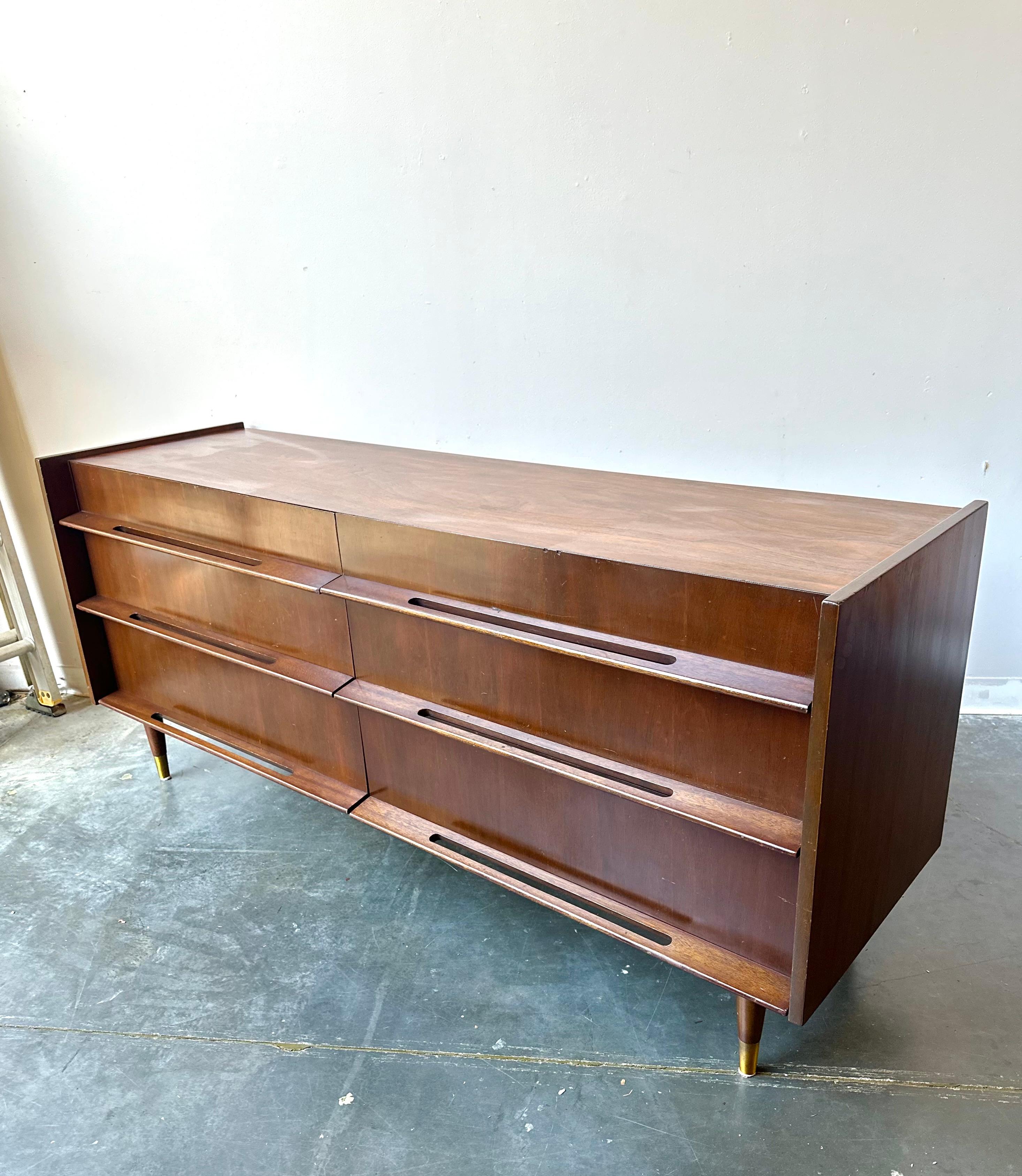 Edmond J Spence sculptural pierced carved pulls in dark walnut.

Gorgeous rare piece that's in fantastic condition,  six very spacious drawers and a very oversized look.

Dimensions: 72