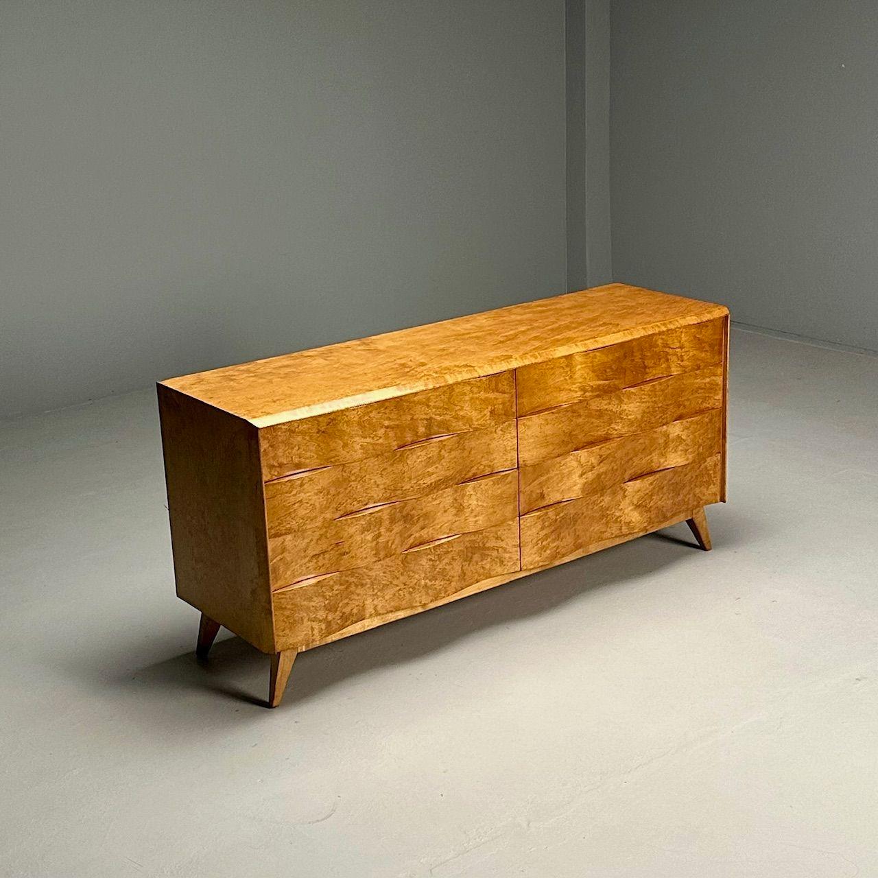 Edmond J Spence, Swedish Mid-Century Modern, Wave Dresser, Maple, 1950s

Swedish modern double dresser or sideboard designed by Edmond J. Spence and produced in Sweden circa 1950s. This example is comprised of maple wood and features eight
