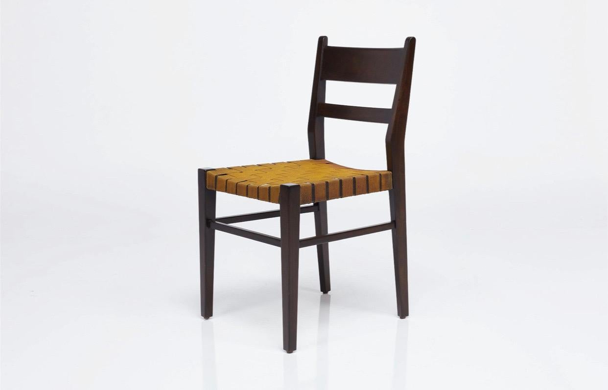 A wonderful and unique set of 6 dining chairs attributed to Edmond J. Spence, likely made in Mexico in the 1940s. Solid mahogany frame with original parachute strap seats (these were used during WWII due to material shortages). Chairs are solid as