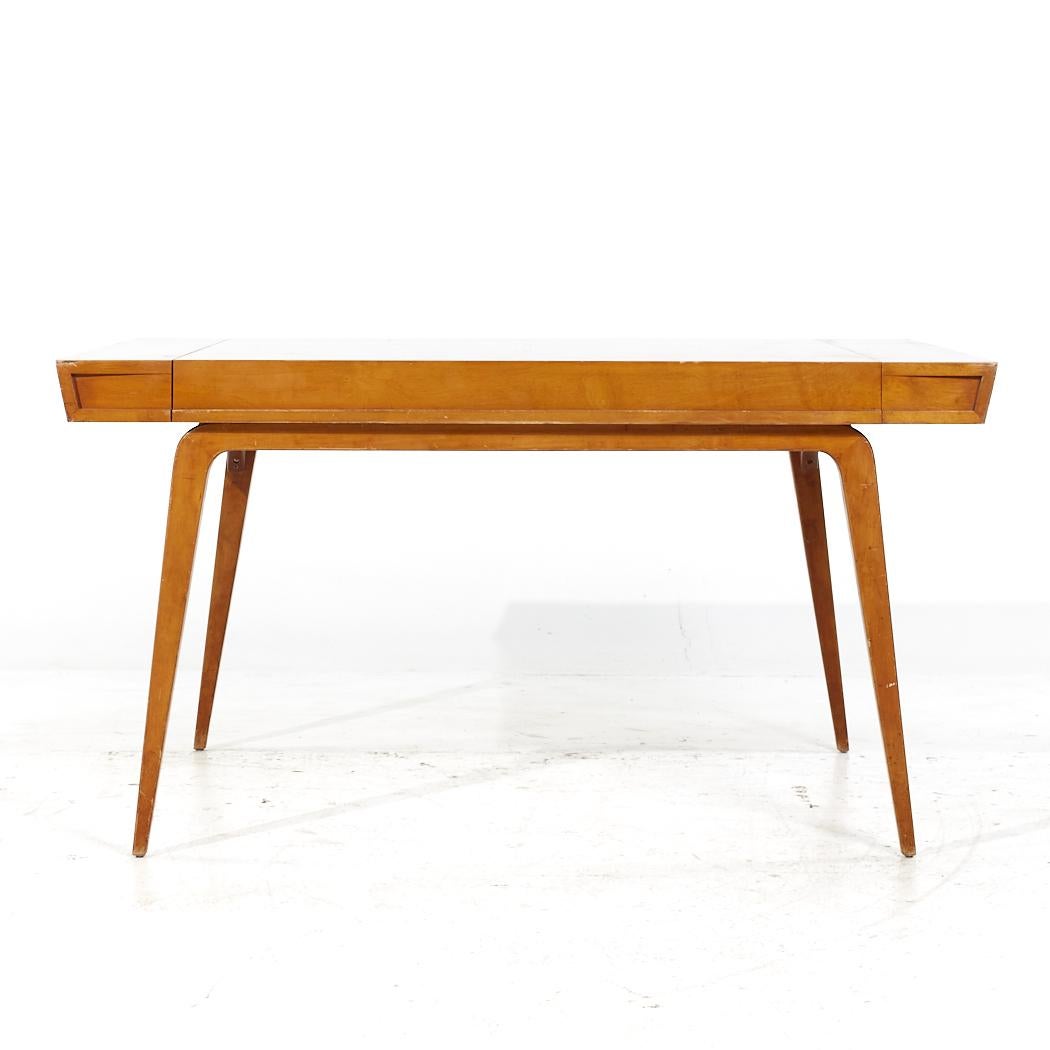 Edmond Spence Mid Century Birch Expanding Dining Table with 2 Leaves

This table measures: 57.25 wide x 41.75 deep x 28.75 inches high, with a chair clearance of 28 inches, each leaf measures 25.5 inches wide, making a maximum table width of 108.25