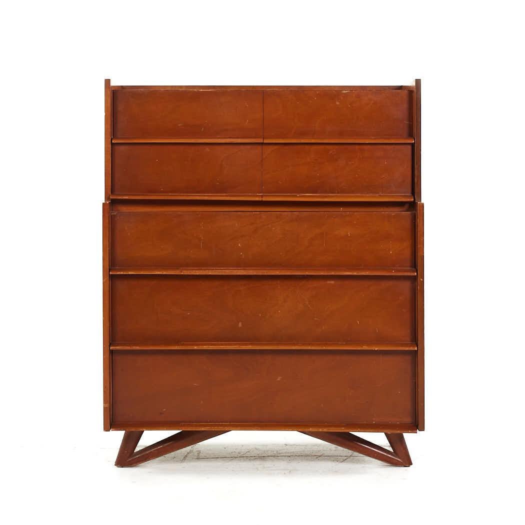 Edmond Spence Mid Century Birch Highboy Dresser

This highboy measures: 38.5 wide x 20.25 deep x 47.5 inches high

All pieces of furniture can be had in what we call restored vintage condition. That means the piece is restored upon purchase so it’s