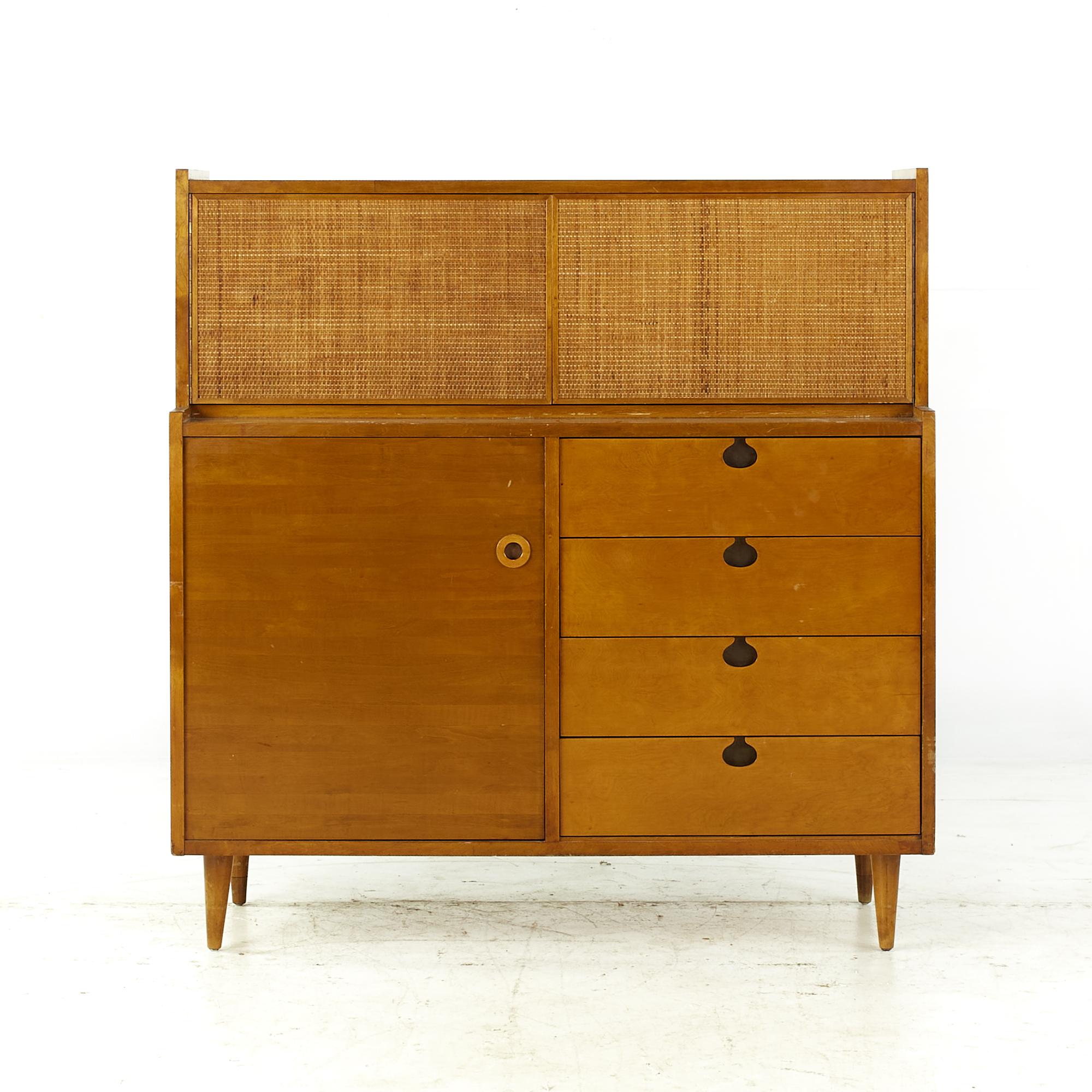 Edmond Spence Midcentury maple highboy dresser.

This highboy measures: 44.25 wide x 18 deep x 45.75 inches high

All pieces of furniture can be had in what we call restored vintage condition. That means the piece is restored upon purchase so