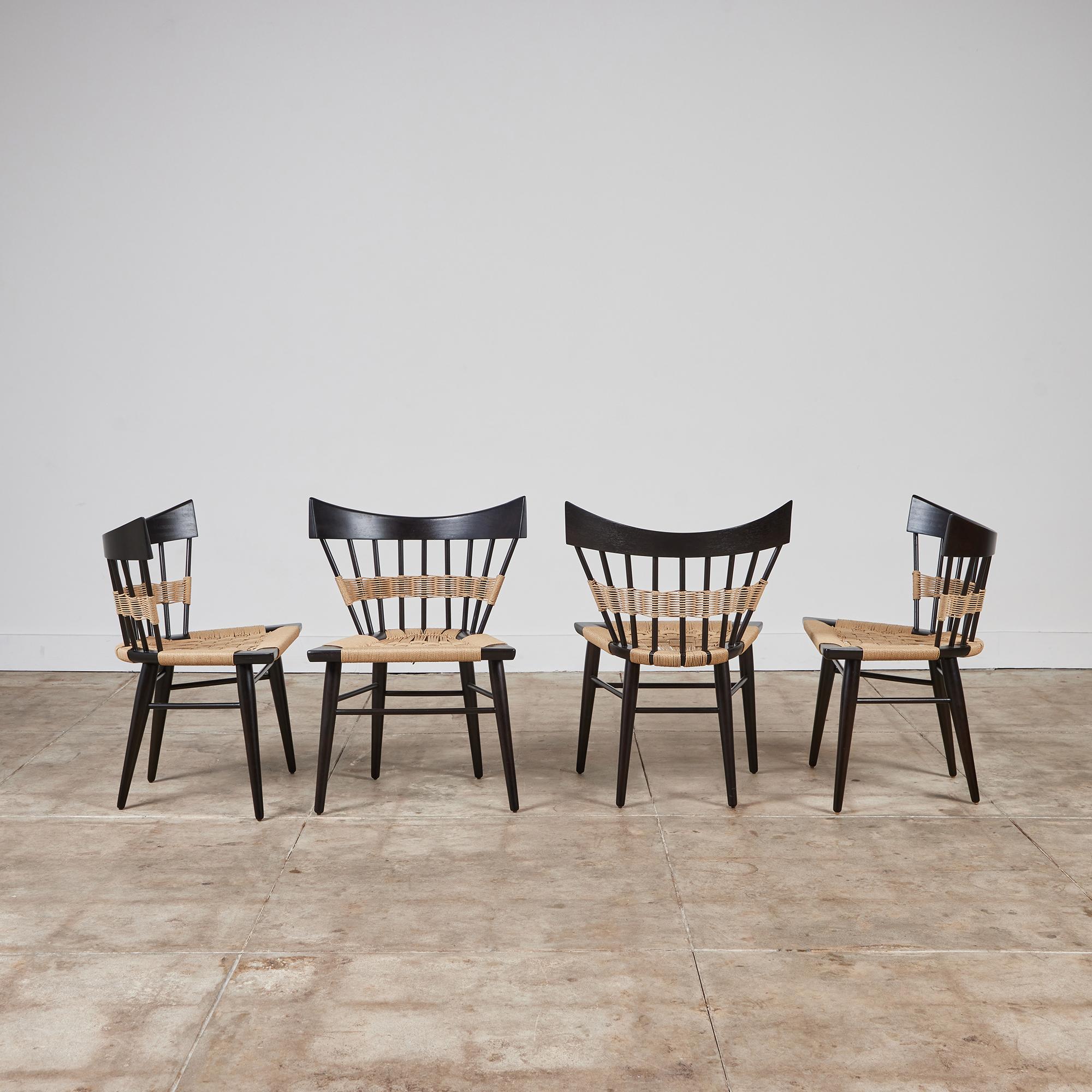 Set of four “Yucatan” chairs by Edmond Spence for Industria Mueblera in Mexico, circa 1950s. The chairs feature a unique and hand sculpted Japanese-inspired interpretation of a traditional spindle back chair similar to the shape of Paul McCobb’s