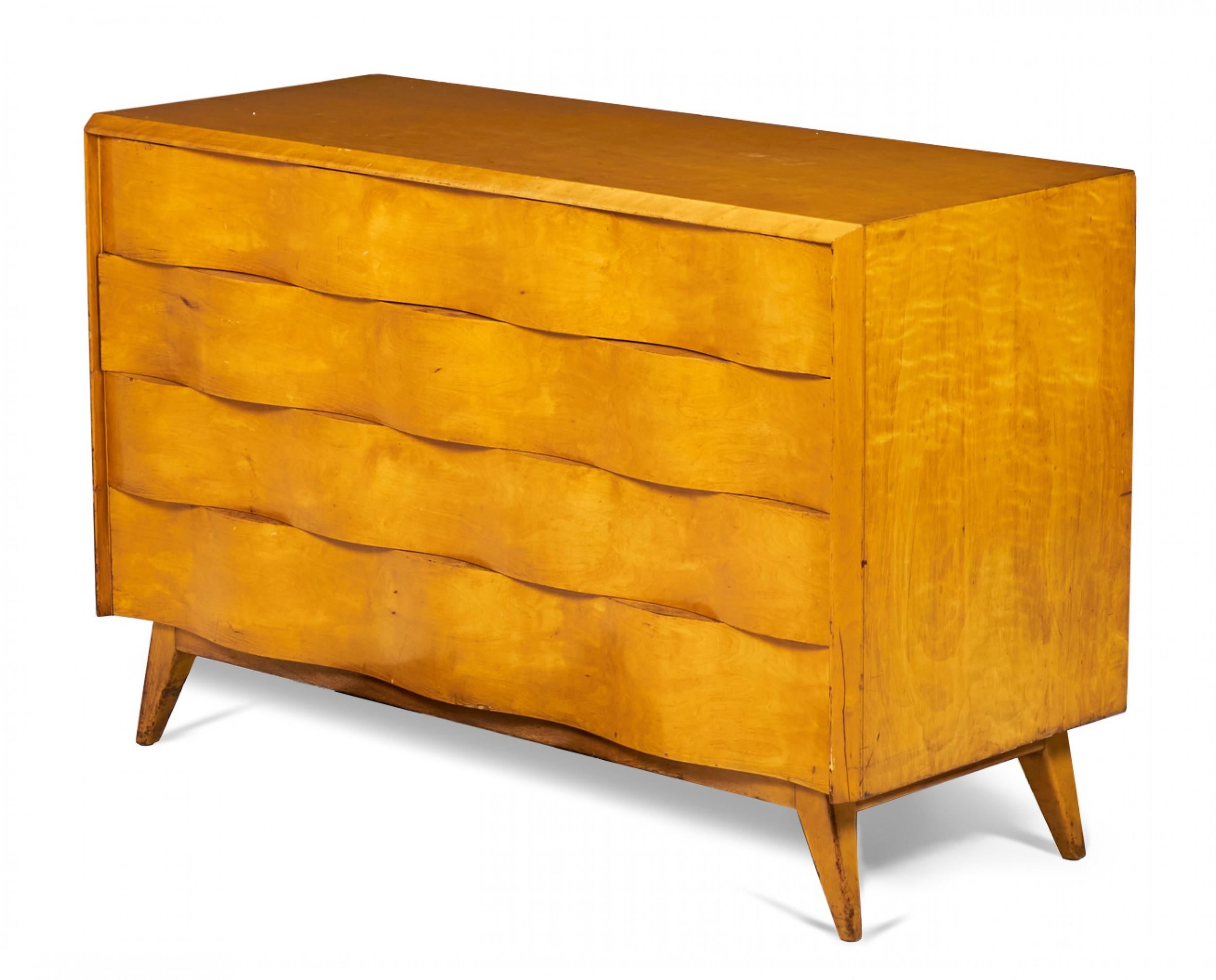 Swedish Mid-Century (1940s) wave front birchwood chest of drawers with four drawers in a birchwood case resting on four tapered angled legs. (EDMOND SPENCE)(Matching nightstands: DUF0141).