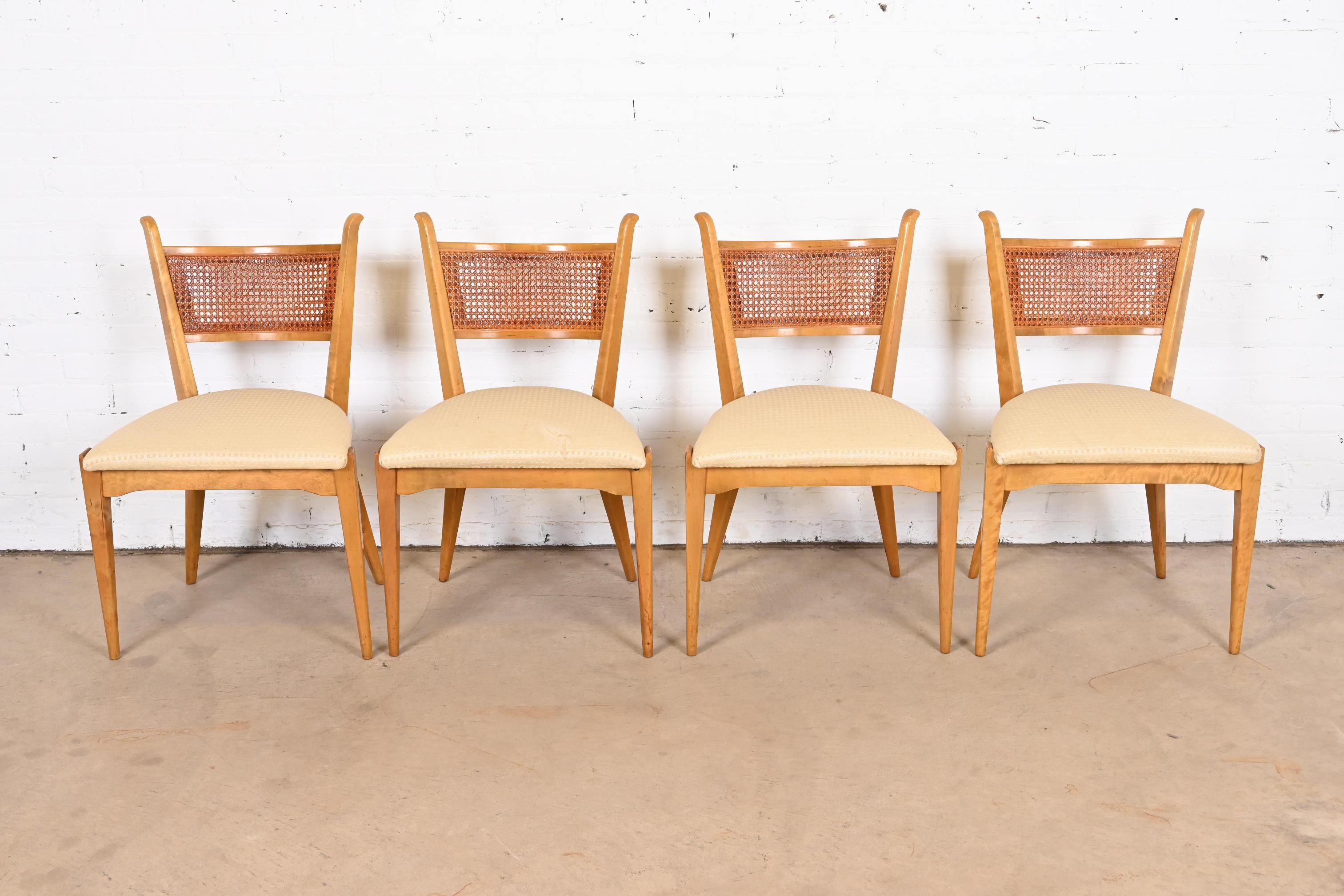 A gorgeous set of four mid-century Scandinavian Modern dining chairs

By Edmond J. Spence

Sweden, 1950s

Solid sculpted maple frames, with caned seat backs and upholstered seats.

Measures: 21