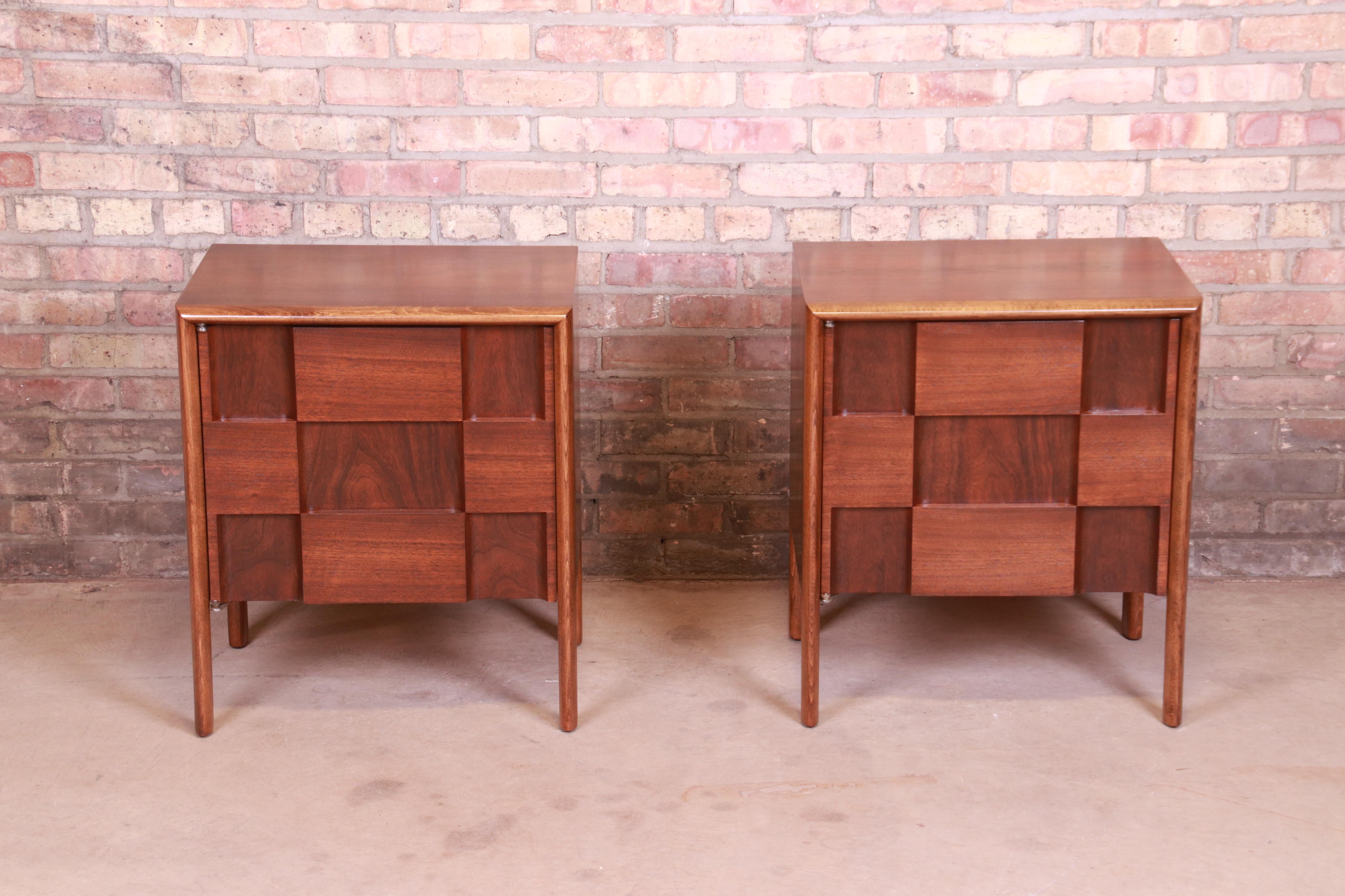 An exceptional pair of midcentury Swedish modern sculpted walnut 