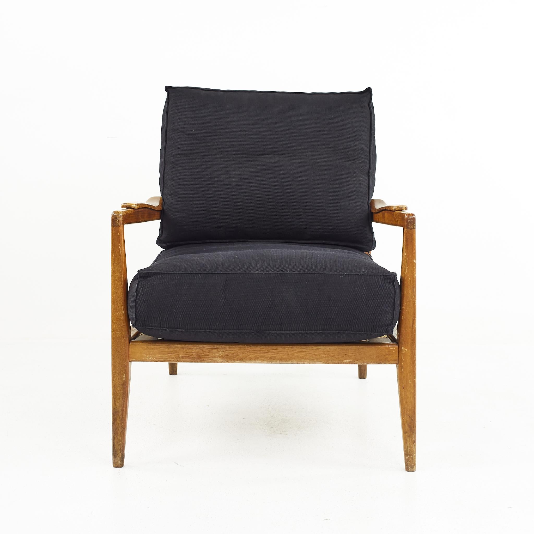 Edmond Spence Urban Aire mid century walnut lounge chair with black upholstery

The chair measures: 27.5 wide x 33.5 deep x 35 high, with a seat height of 19 inches and arm height of 23 inches

All pieces of furniture can be had in what we call