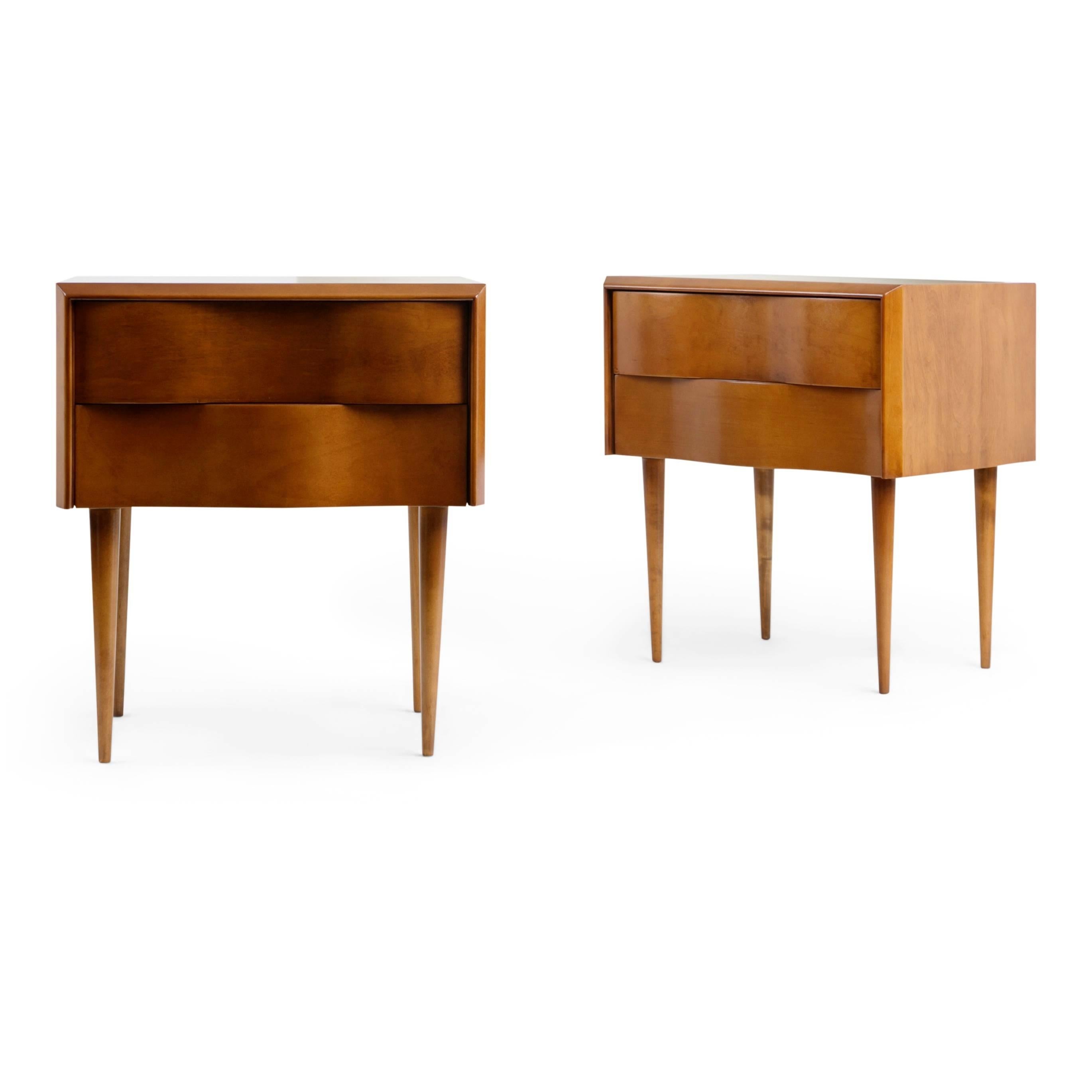 As part of his works American designer, Edmond J. Spence, often misspelled Edmund, created a series of Swedish-inspired furniture that was manufactured in Sweden and imported by Walpole Furniture of Massachusetts. This pair of nightstands are an