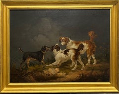 Antique Spaniels and a terrier in a landscape