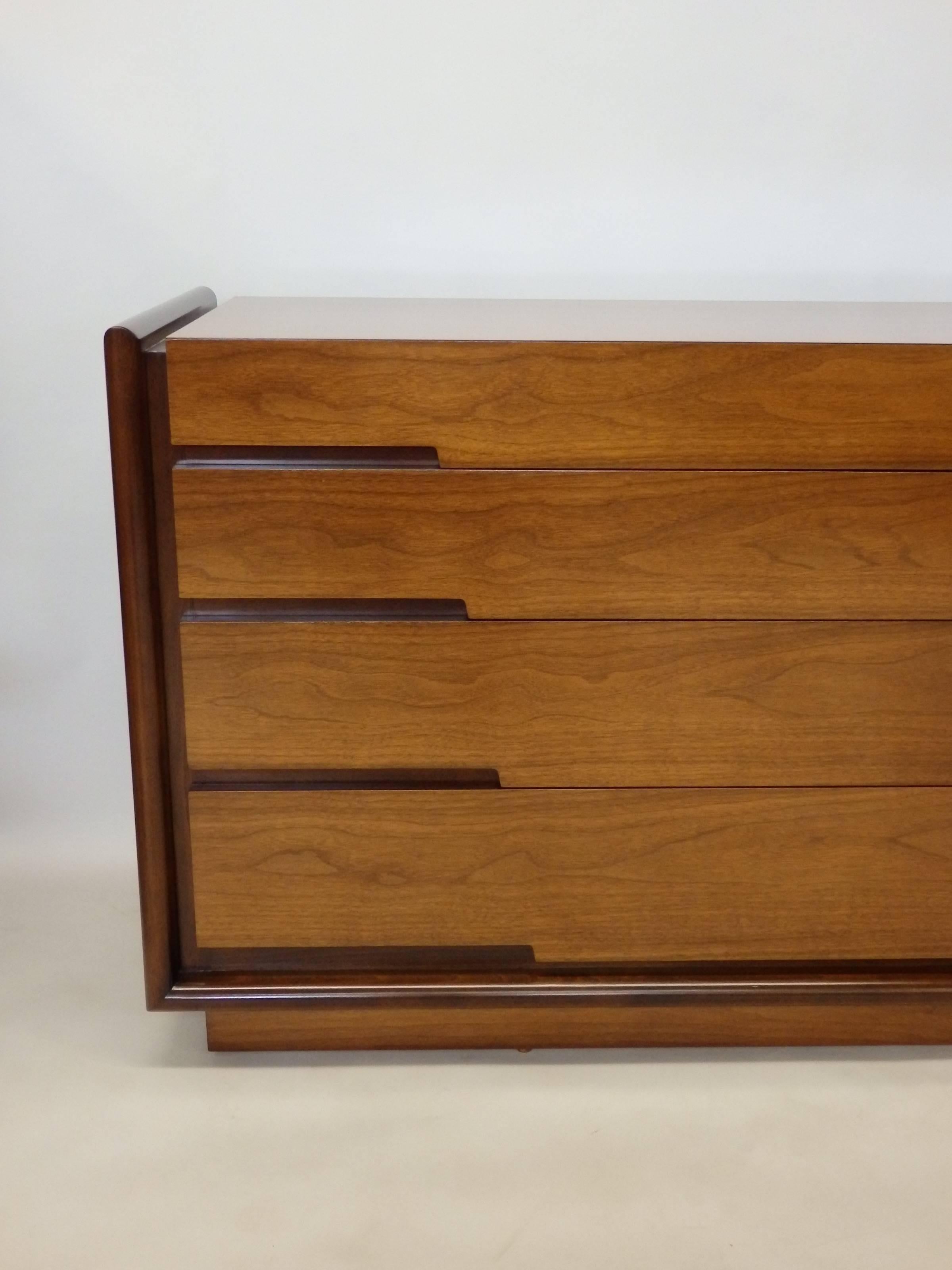 Long low dresser designed by Edmund Spence. Subtle design of tapering drawer sizes having  tapered length  pulls as well . Produced in Sweden.