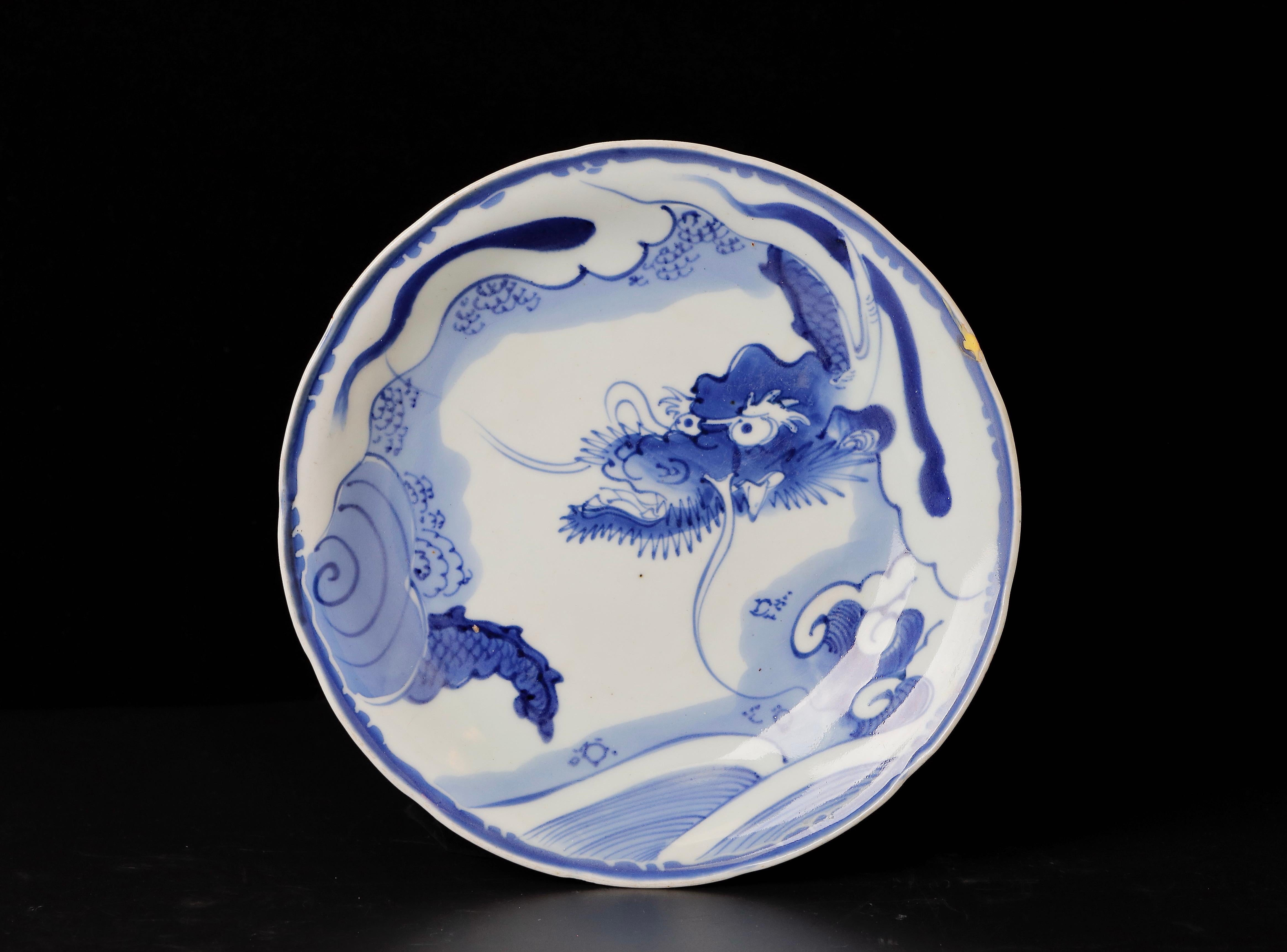 Superb Early Imari Porcelain Plate with Dragon Motif

Experience the timeless beauty of this superb Imari porcelain plate adorned with a captivating dragon motif. This exquisite piece hails from the late Edo period, dating back to the 18th-19th