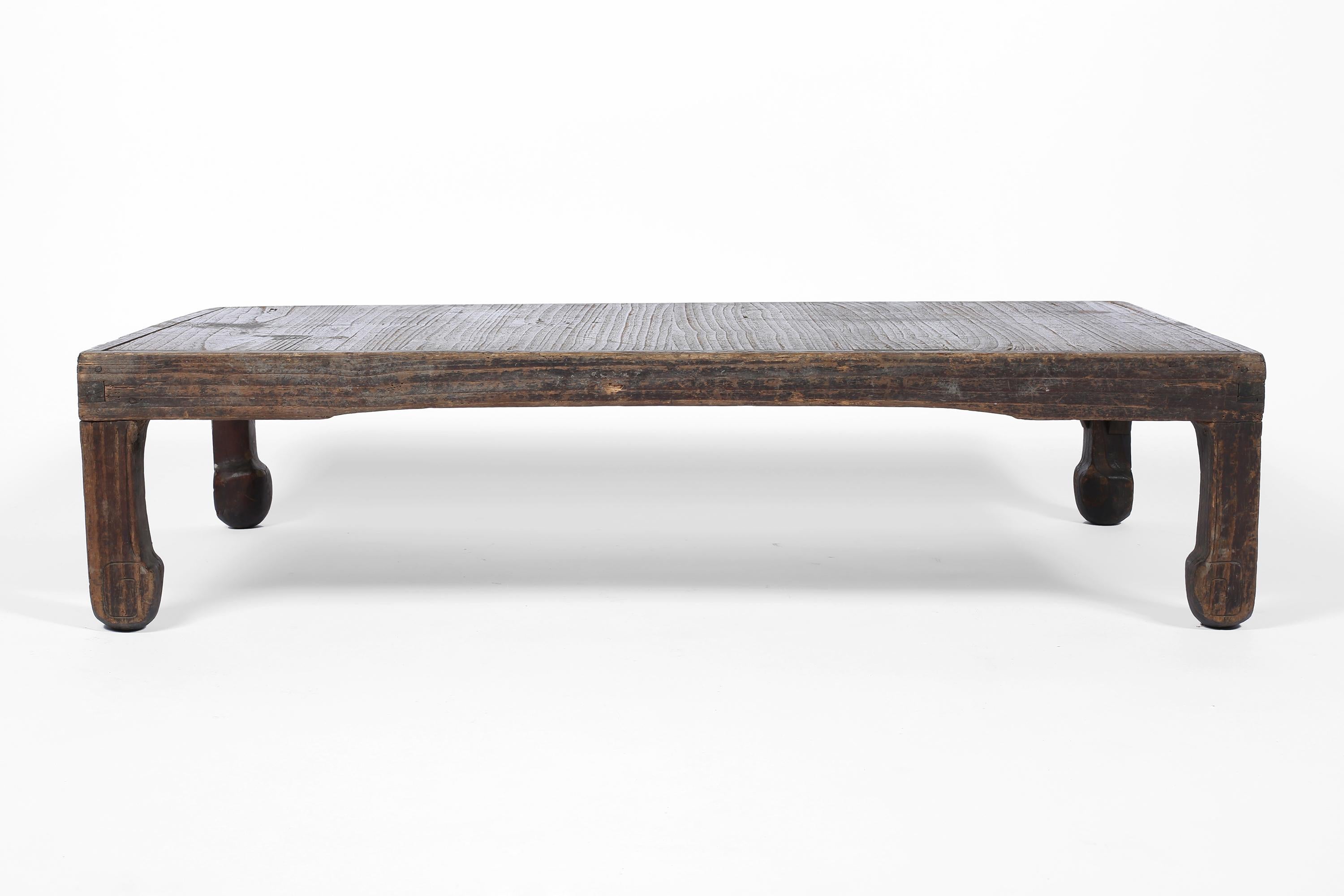 An Edo period low ‘zataku’ table in heavily patinated cedar timber. Pegged and jointed in construction, with traditional decorative carved legs. Japanese, circa 1850.