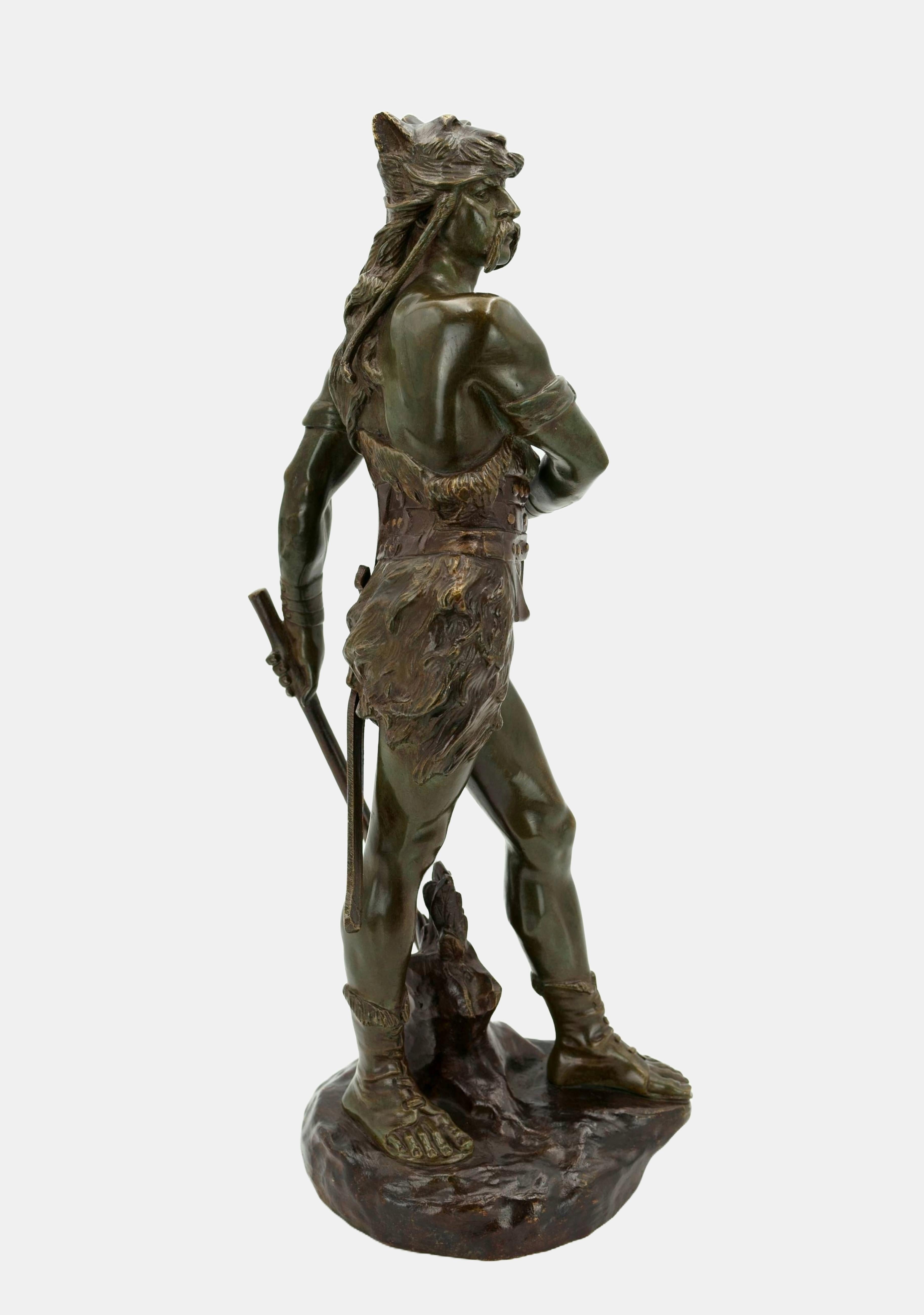Edouard Drouot (1859 Sommevoire - 1945 Paris), The Gallic warlord Vercingetorix, 1915. Green and brown patinated bronze on a cast naturalistic plinth, 43 cm (height) x 15 cm (width) x 18 cm (depth), weight 5.1 kg. Signed “E.[douard] Drouot” and