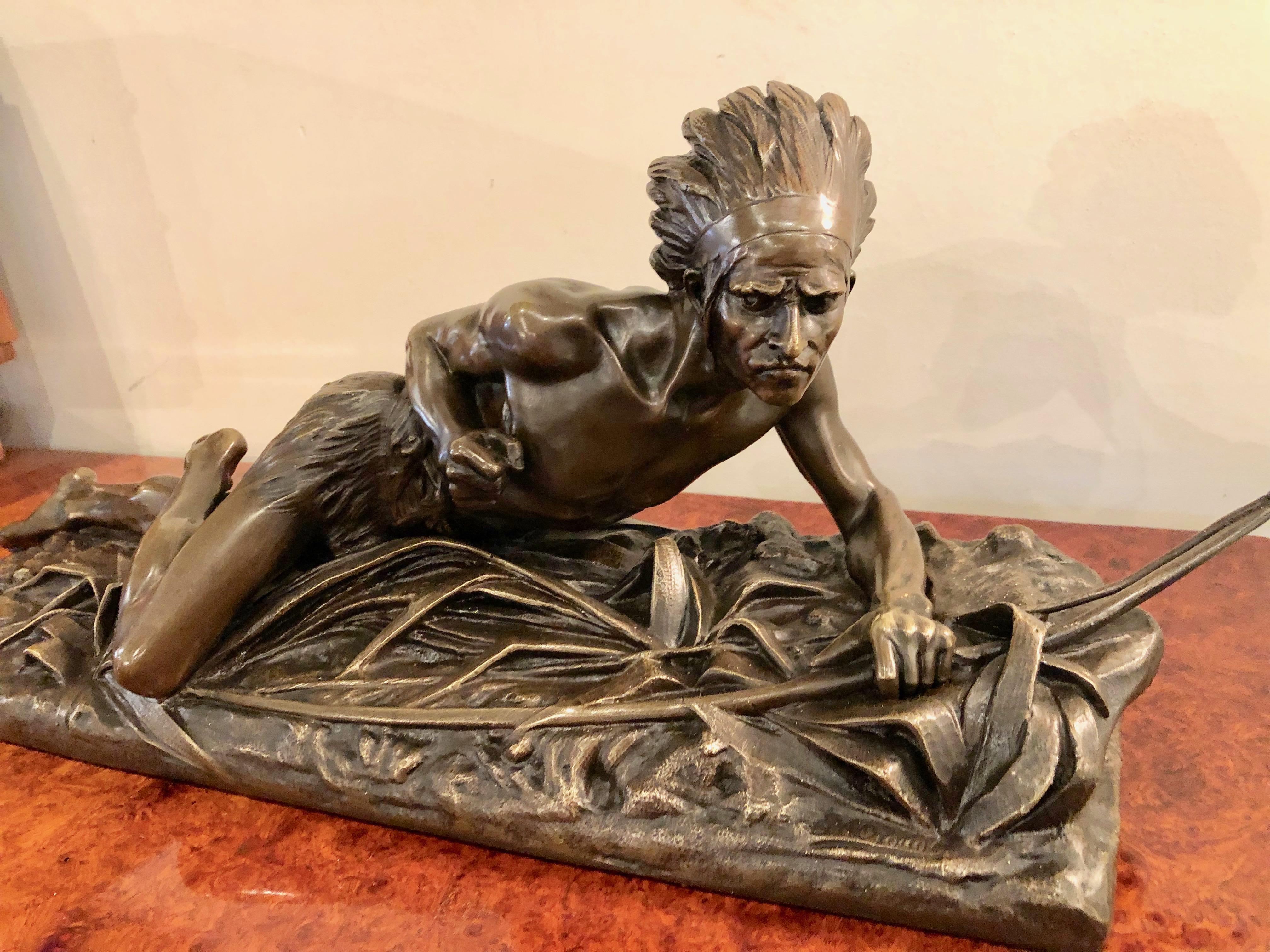 Indian bronze signed E. Drouot. Cast with plenty of detail depicting an Indian man who is on the look out while holding a bow in hunting position. Drouot did multiple sculptures rendering the American Indian theme.

Edouard Drouot was born in