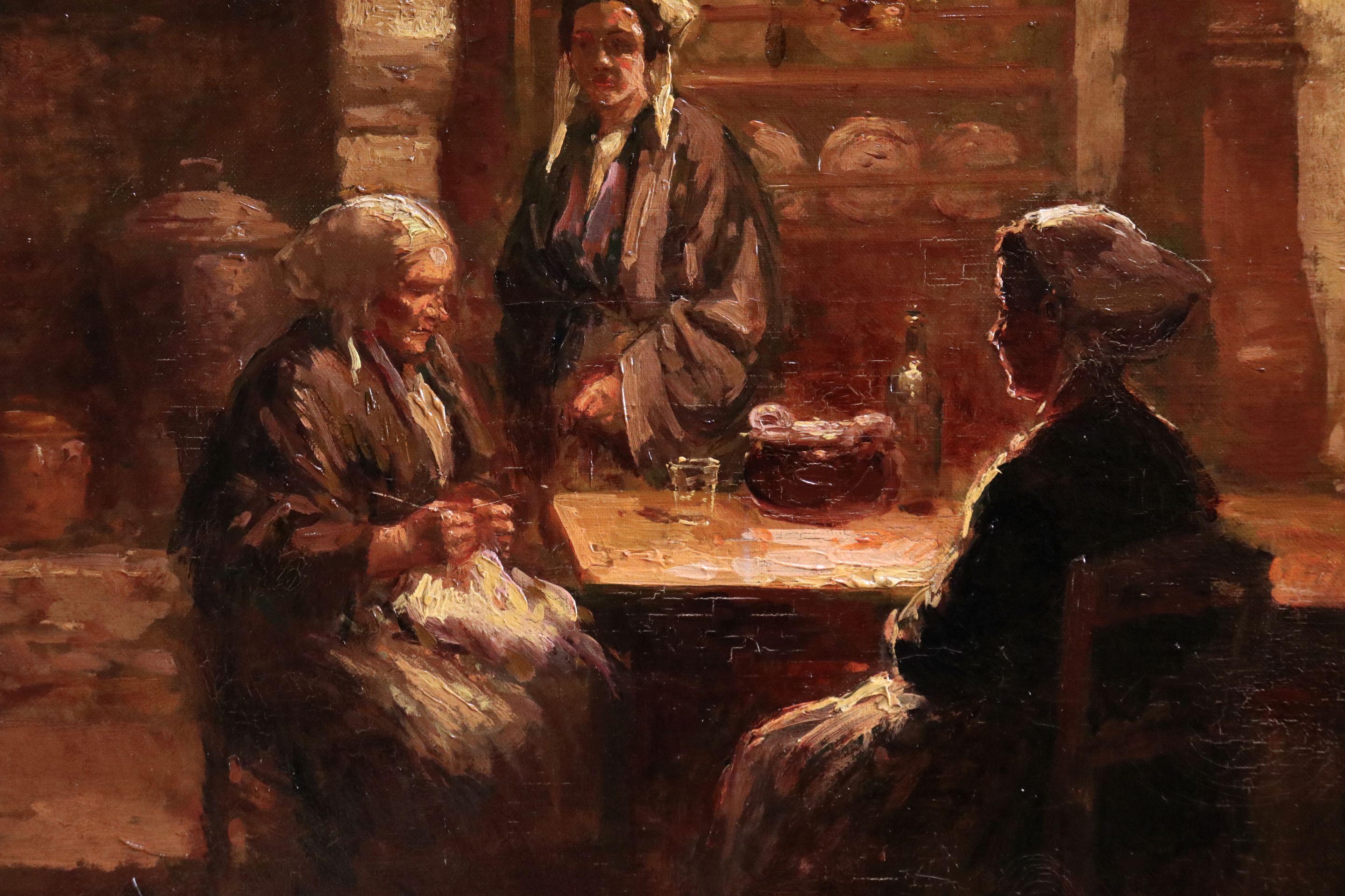 Evening in a Breton Kitchen - 20th Century Oil, Figures in Interior by E Cortes - Black Interior Painting by Édouard Leon Cortès