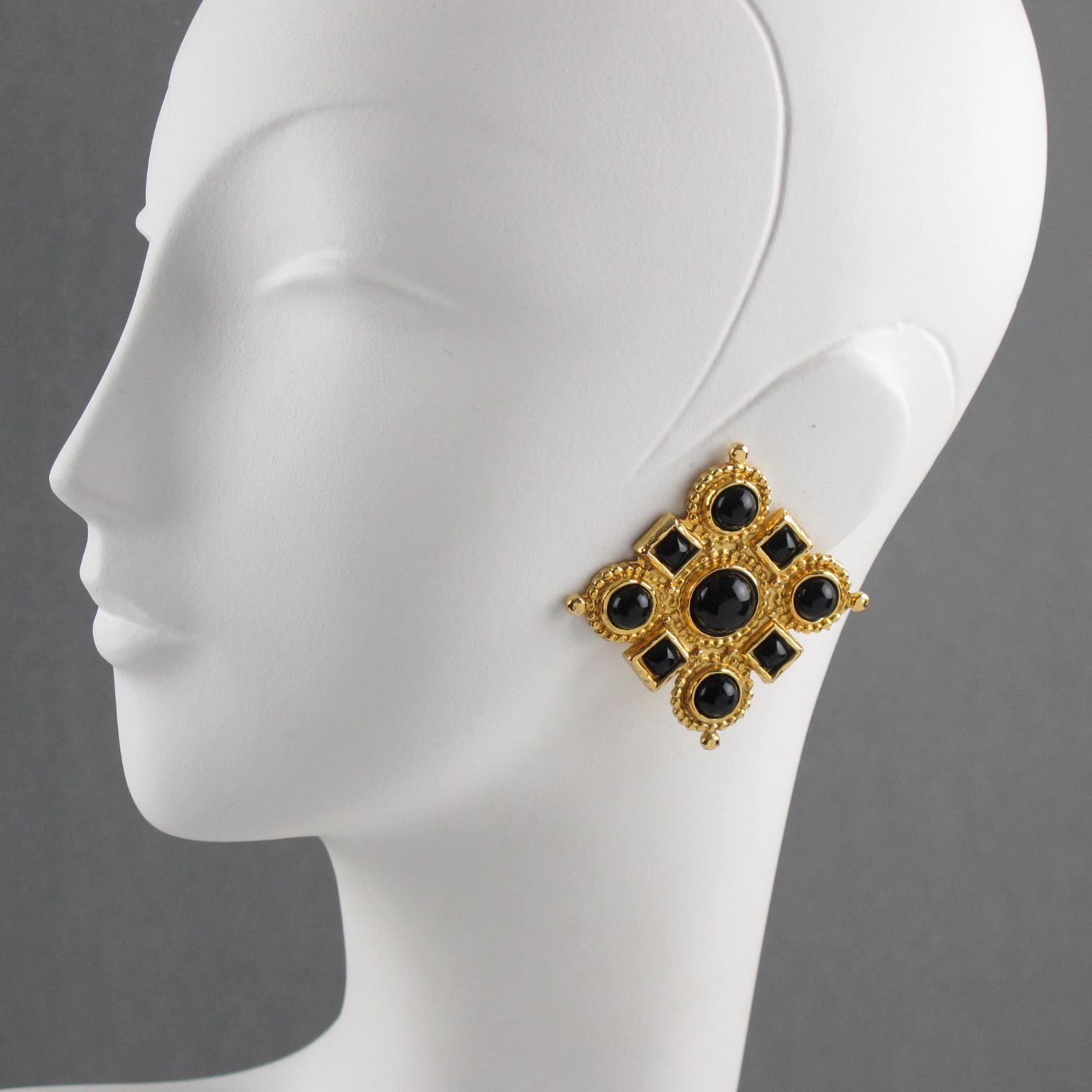 Stunning oversized Edouard Rambaud Paris signed clip-on earrings. Byzantine revival inspired design with a gilt metal square shape all textured topped with resin and glass cabochons in true licorice black color. Signed underside: 