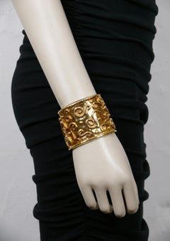 EDOUARD RAMBAUD para LANCOME Brazalete arabesco vintage en tono dorado
