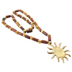 Vintage Edouard Rambaud Gilt Metal and Wood Necklace with Sun Pendant