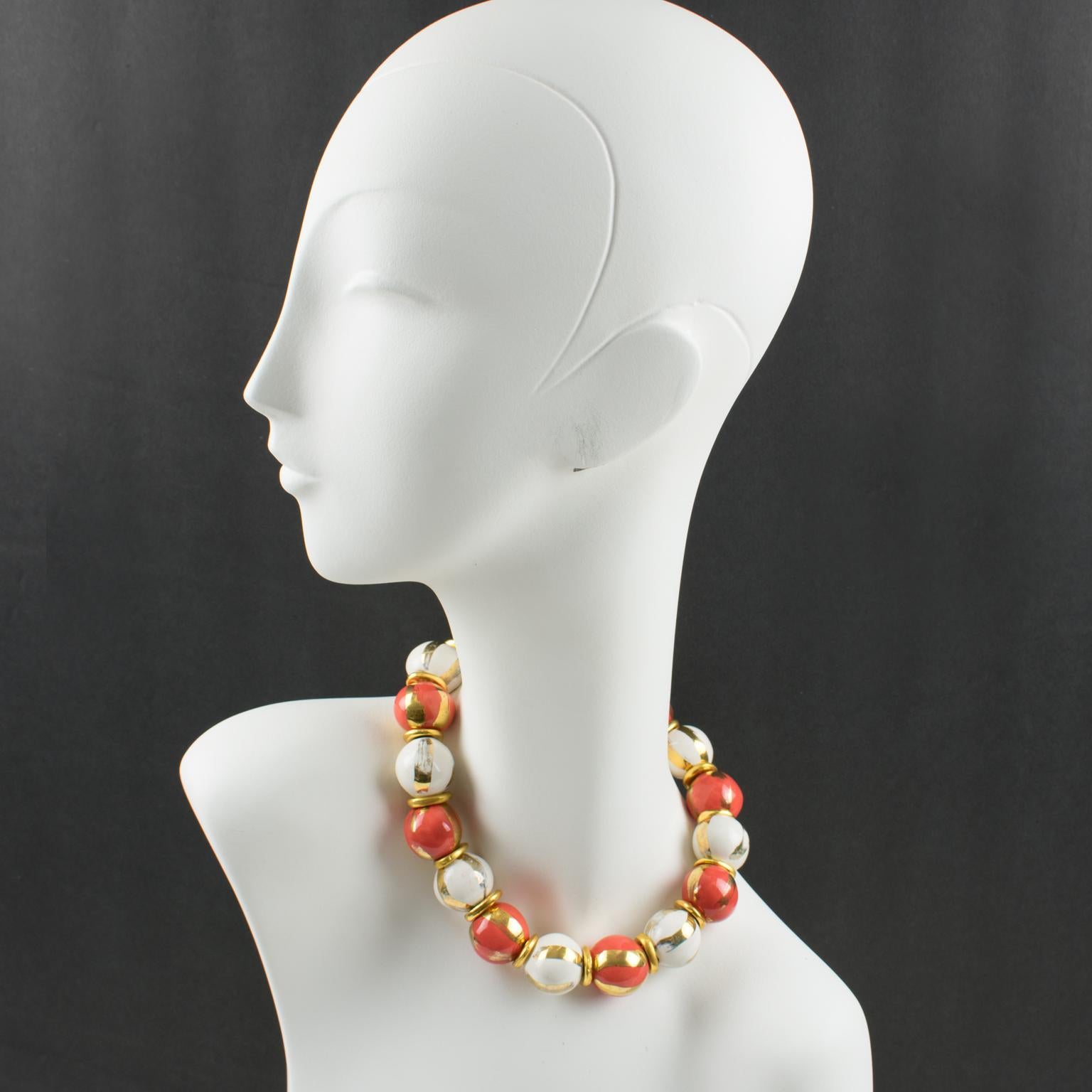 This lovely Edouard Rambaud Paris ceramic choker necklace features a romantic-inspired design with large ceramic beads in assorted white and pink salmon colors ornated with gilt paint. Gilt metal bead spacers are embellishing the design. The choker