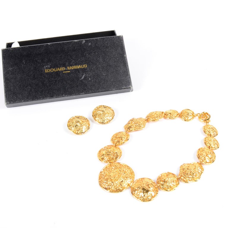 This is a beautiful Edouard Rambaud vintage earrings with the matching necklace  that comes with the original box! The textured gold plated metal necklace is 20