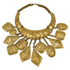Collana Edouard Rambaud Vintage, tonalità oro, di ispirazione orientale con multi charms