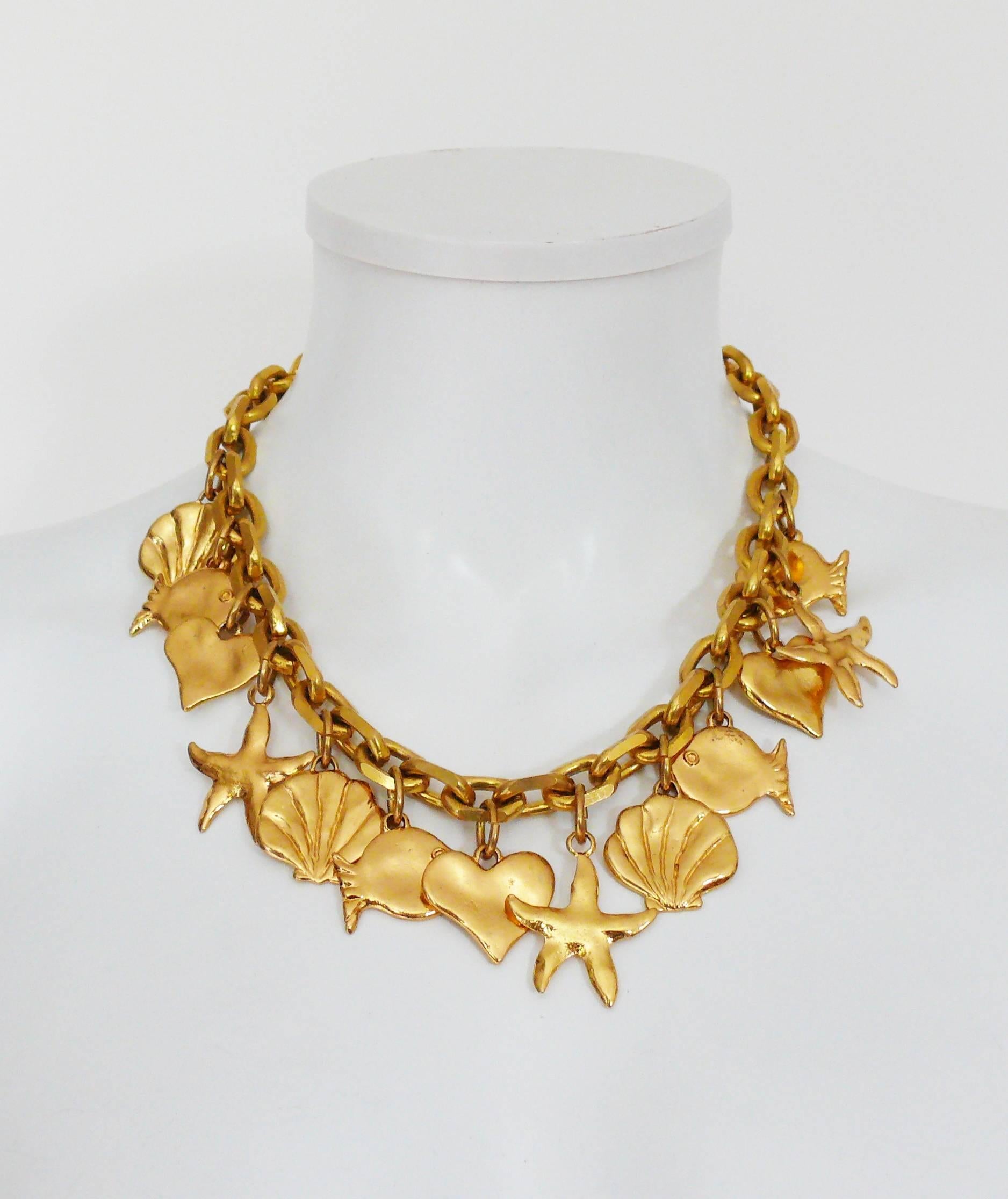 EDOUARD RAMBAUD vintage gold toned necklace featuring a chunky chain, sea life charms and hearts.

Marked EDOUARD RAMBAUD Paris.

T-bar toggle closure.

Indicative measurements :  length approx. 48 cm (18.90 inches).

JEWELRY CONDITION CHART
- New
