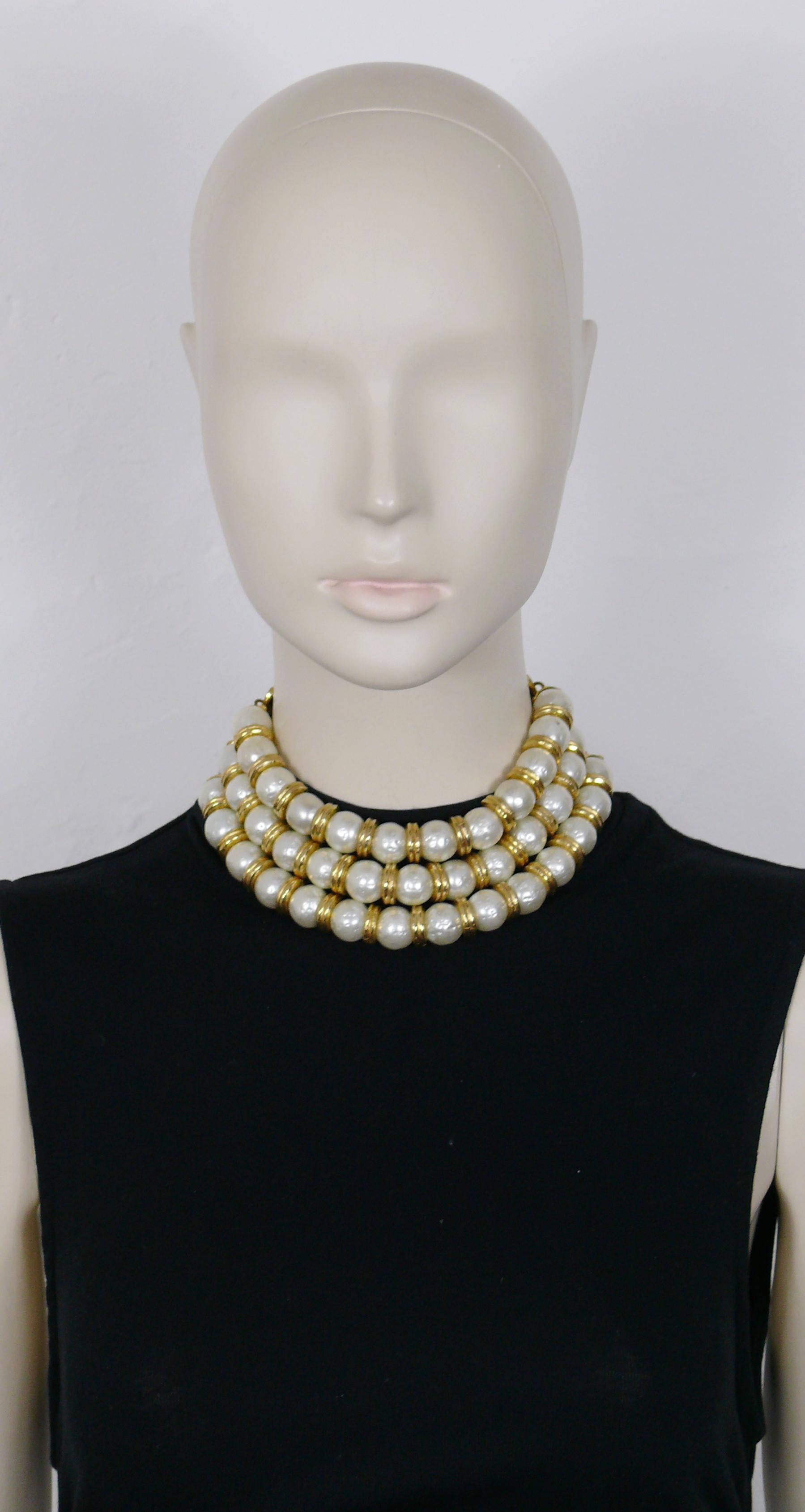 EDOUARD RAMBAUD vintage three strand choker necklace featuring large textured faux pearls in a gold toned setting.

Adjustable hook clasp closure.
Extension chain.

Marked EDOUARD RAMBAUD Paris.

Indicative measurements : adjustable length from