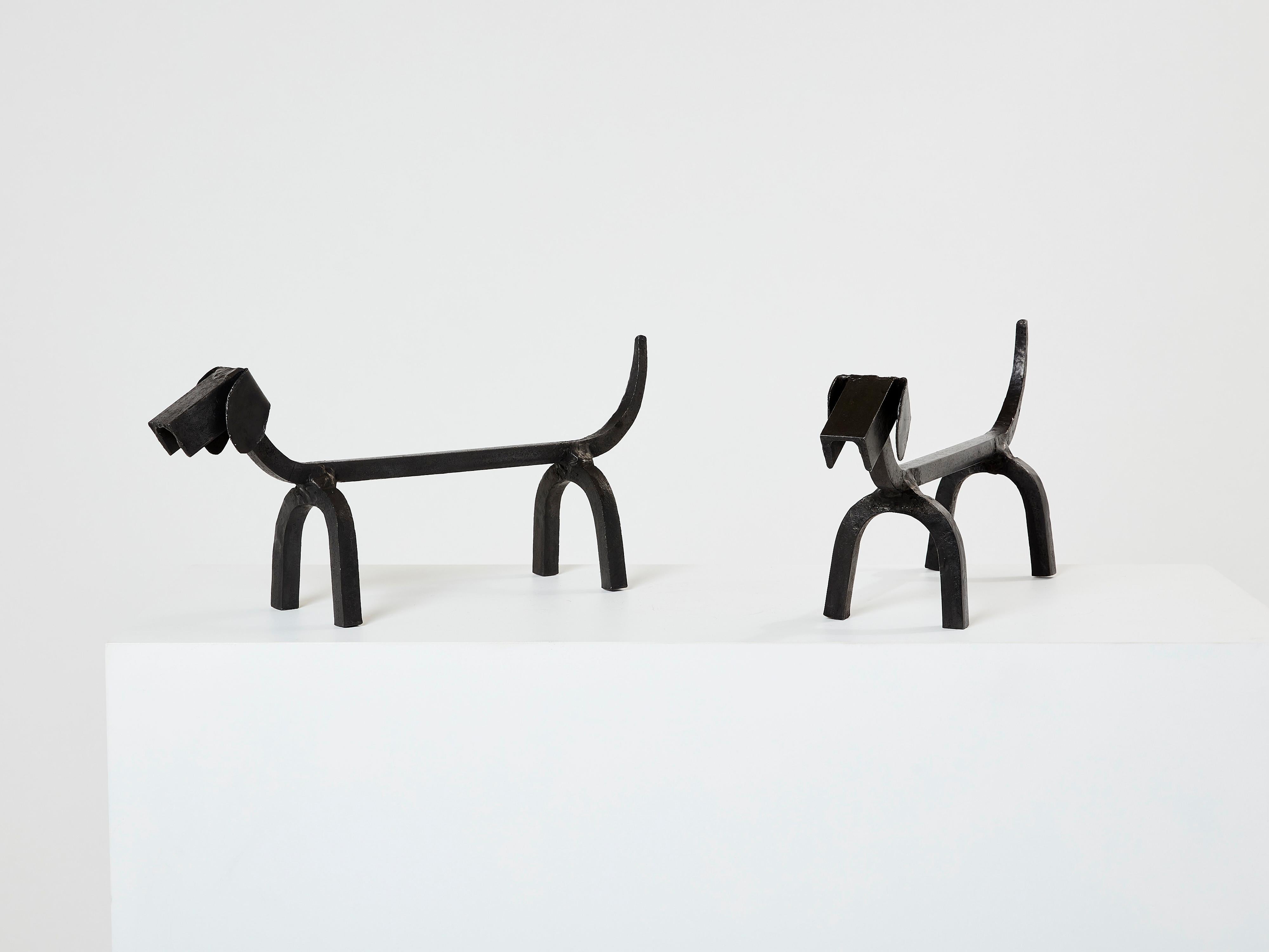 Here is a pair of vintage wrought iron dachshund andirons designed by Edouard Schenck in the early 1950s. Edouard Schenck was a French andiron maker who designed zoomorphic pieces as andirons. The quality of his work is actually unmatched when it
