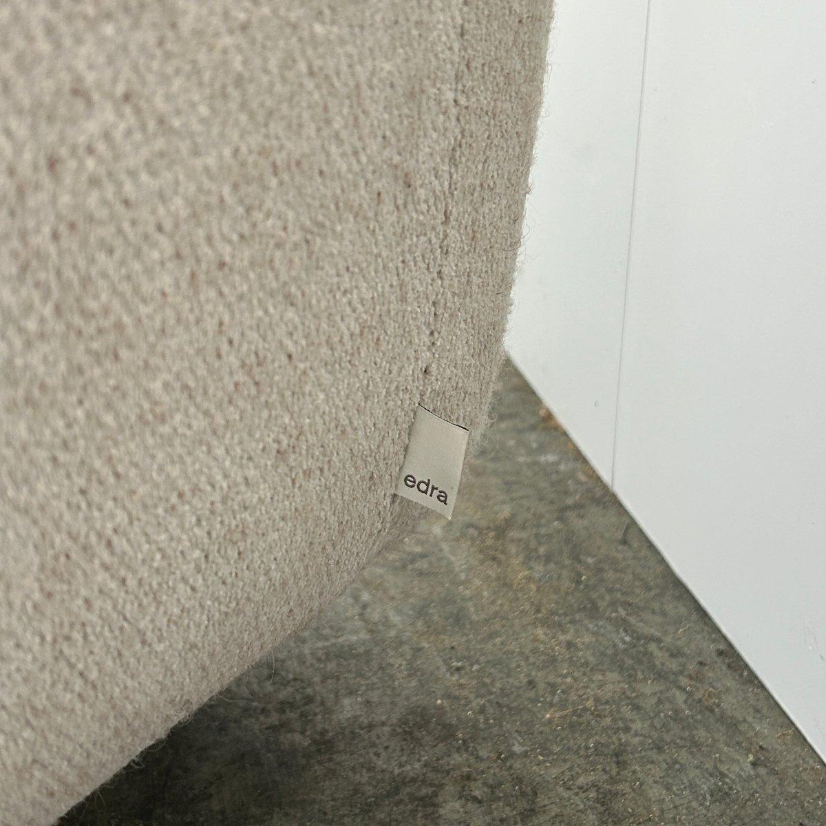 Introducing the Grande Soffice Sofa and Footstool by Edra, a luxurious addition to any living space. The sofa boasts a soft and inviting design, with plush cushions filled with goose down and a deep seat for ultimate comfort. The unique shape and