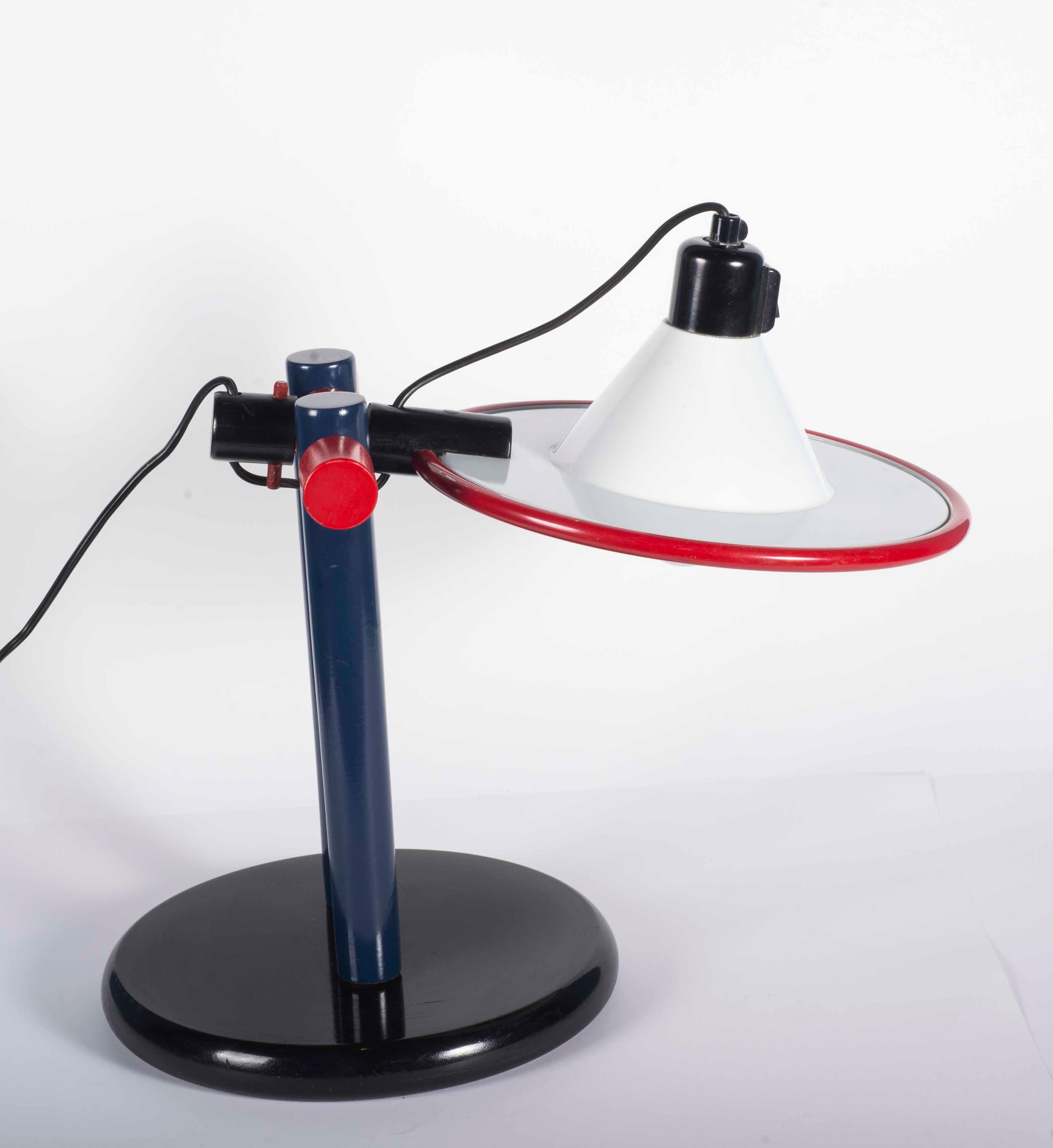 1979 Desk lamp in wood and metal blue red and white. In working order with switch at the top.
Design by Eduardo Albors/Caps i mans for LAMSAR / Spain.