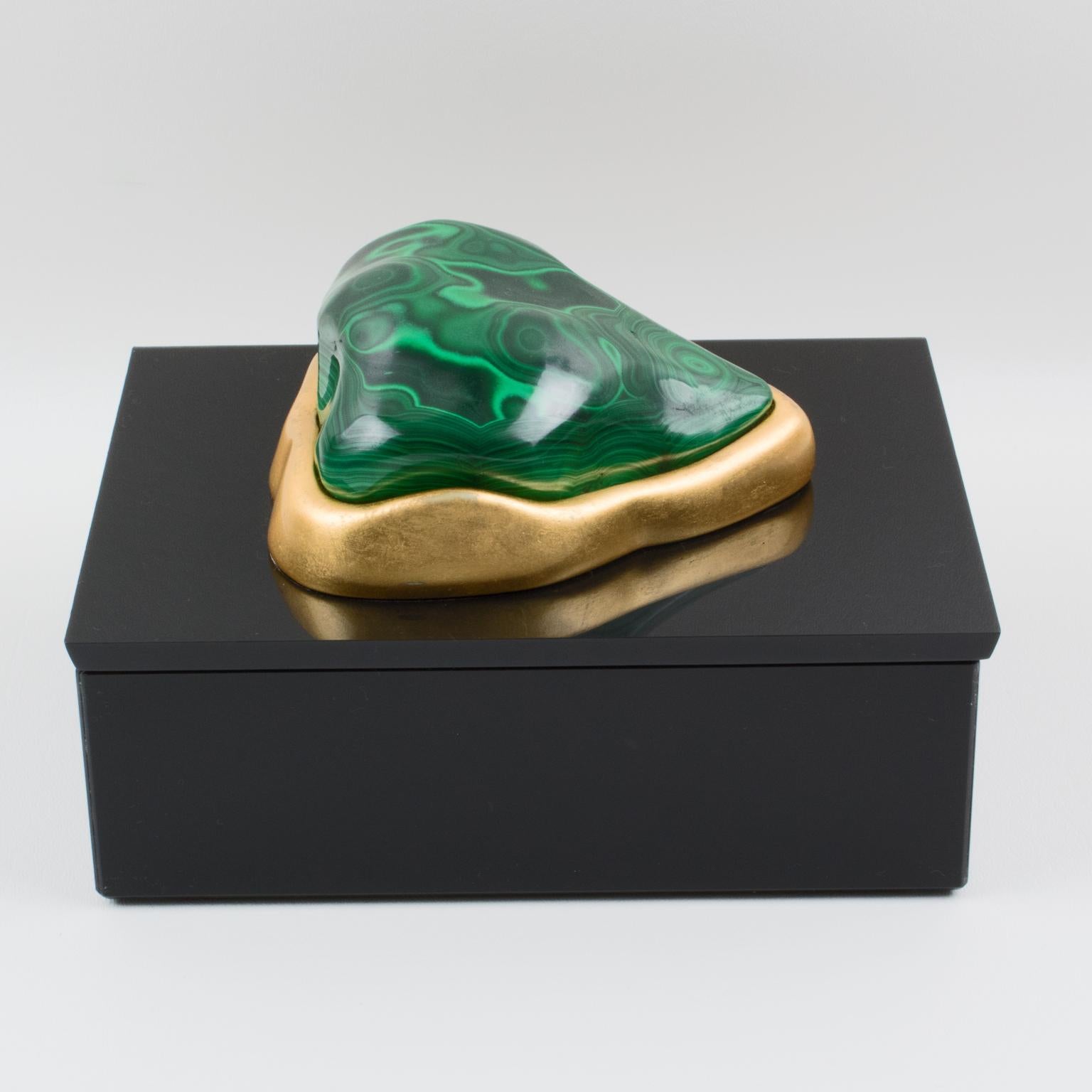 Known as the Demeter Malachite box, this refined decorative box by Eduardo Garza Studio is individually hand-made in New York City. Black Lucite box crowned with uniquely shaped Malachite stone individually mounted in a sculpted setting. The mounted
