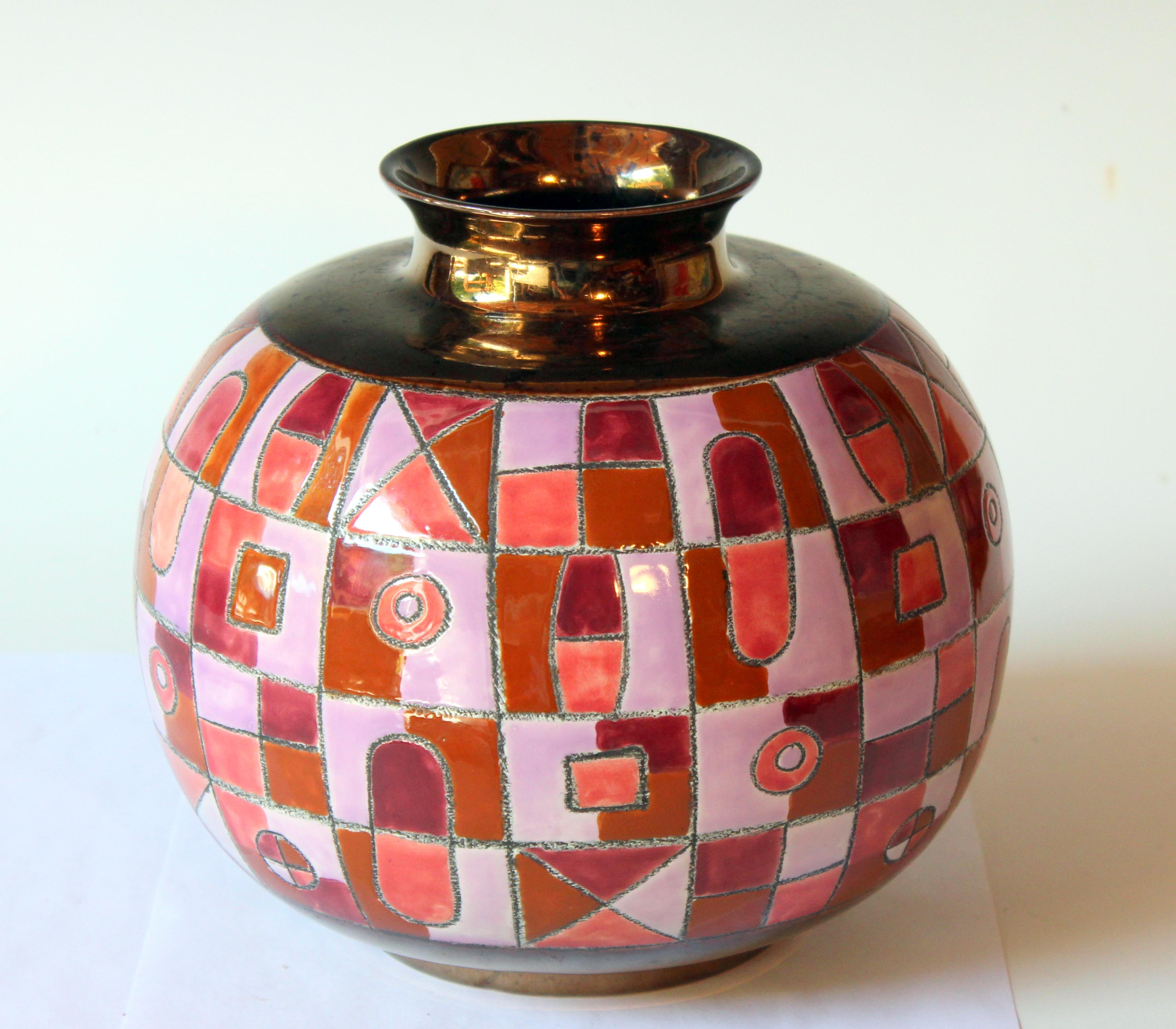 Vintage ceramic vase with lively enameled geometric pattern between copper luster base and top by renowned Ecuadoran artist Eduardo Vega. Signed on lower panel, circa 1970s. Measures: 8