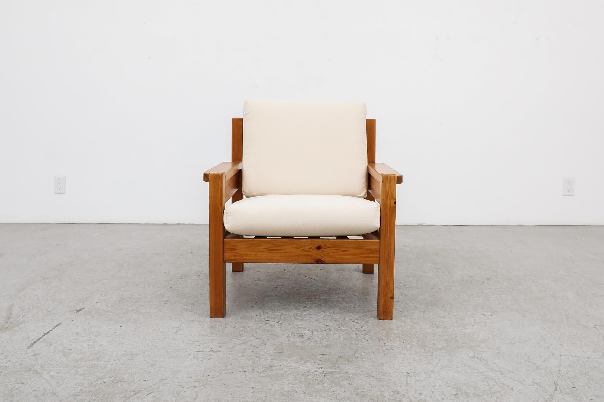This simple pine crate style lounge chair is inspired by Norwegian designer, Edvin Helseth. The frame is in good original condition, the cushions are newly upholstered in natural canvas. Wear consistent with its age and use.