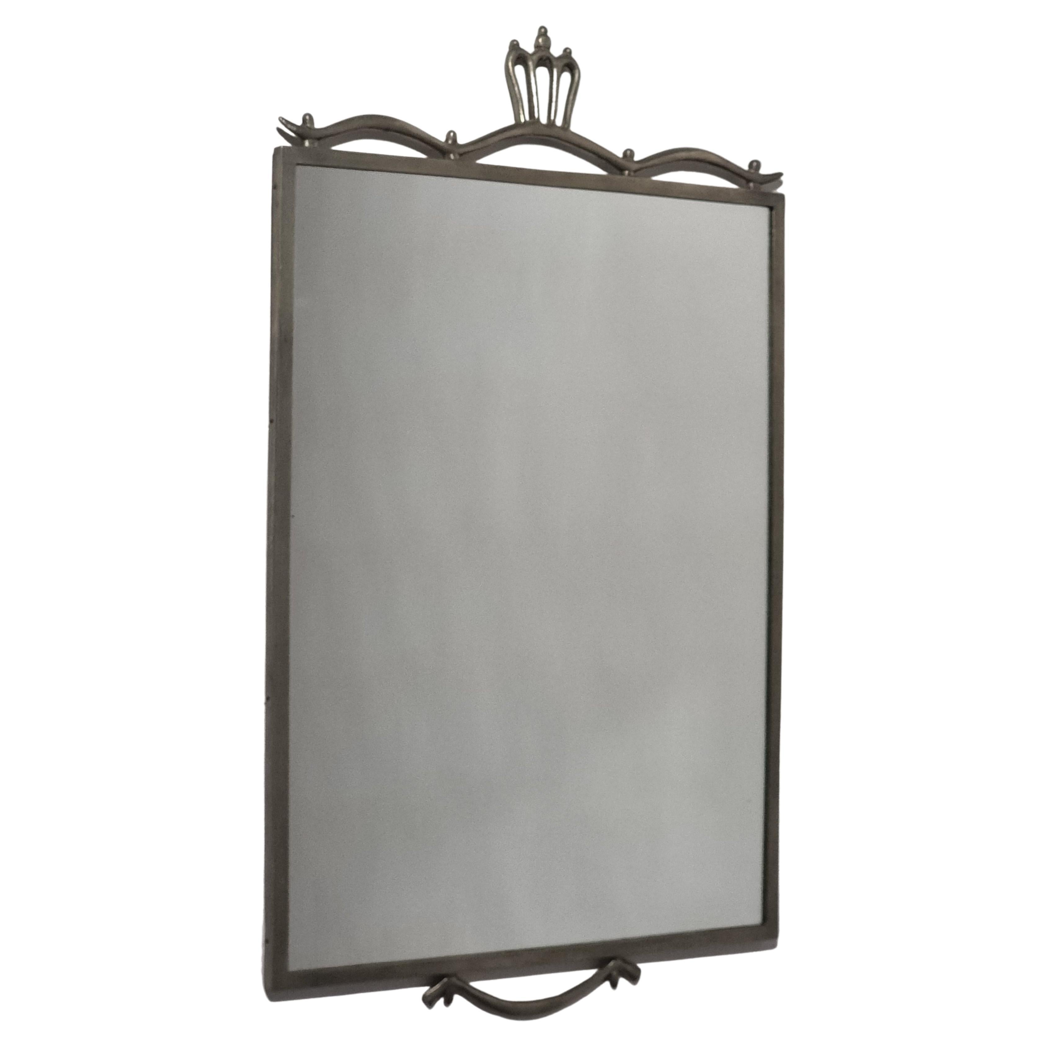 A decorative mirror in pewter by swedish designer Edvin Ollers, dated A8/1927. 

Marked with Ollers and Stockholm hallmarks. Nice patina, normal signs of age, smaller signs of wear.

 