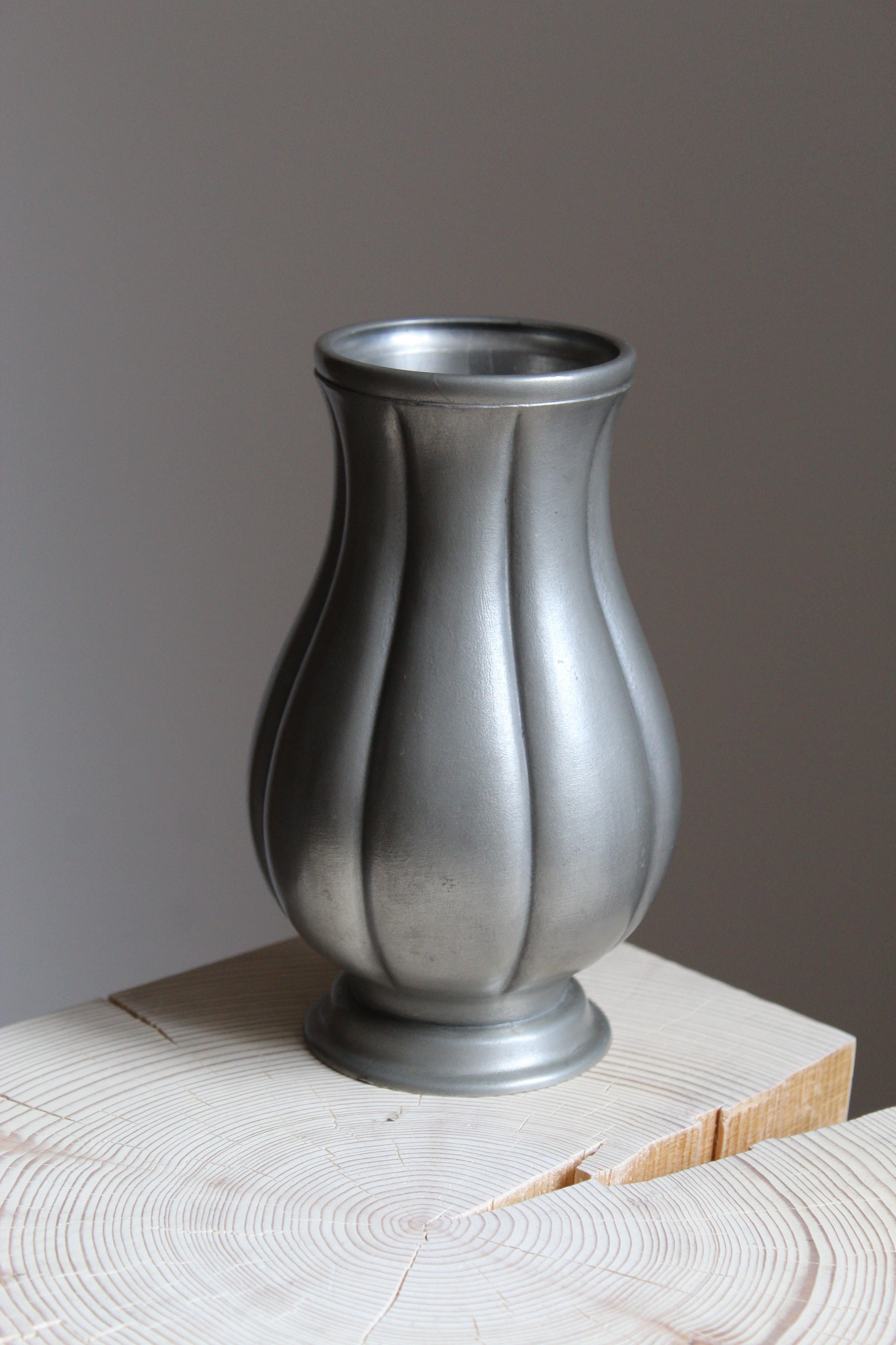 A vase, designed by Edvin Ollers. Produced by Schreuder & Olson, Sweden, 1952. Brushed matte surface. Stamped.
