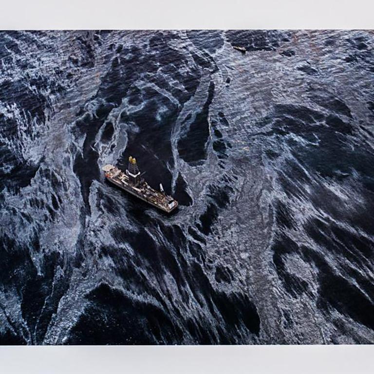 His images, which at times approach abstraction, present a bizarre tension between beauty and desecration. 

At first glance, the ship seems to be stationary on a marble-patterned surface that is both shiny, hypnotic and alluring.

When the viewer