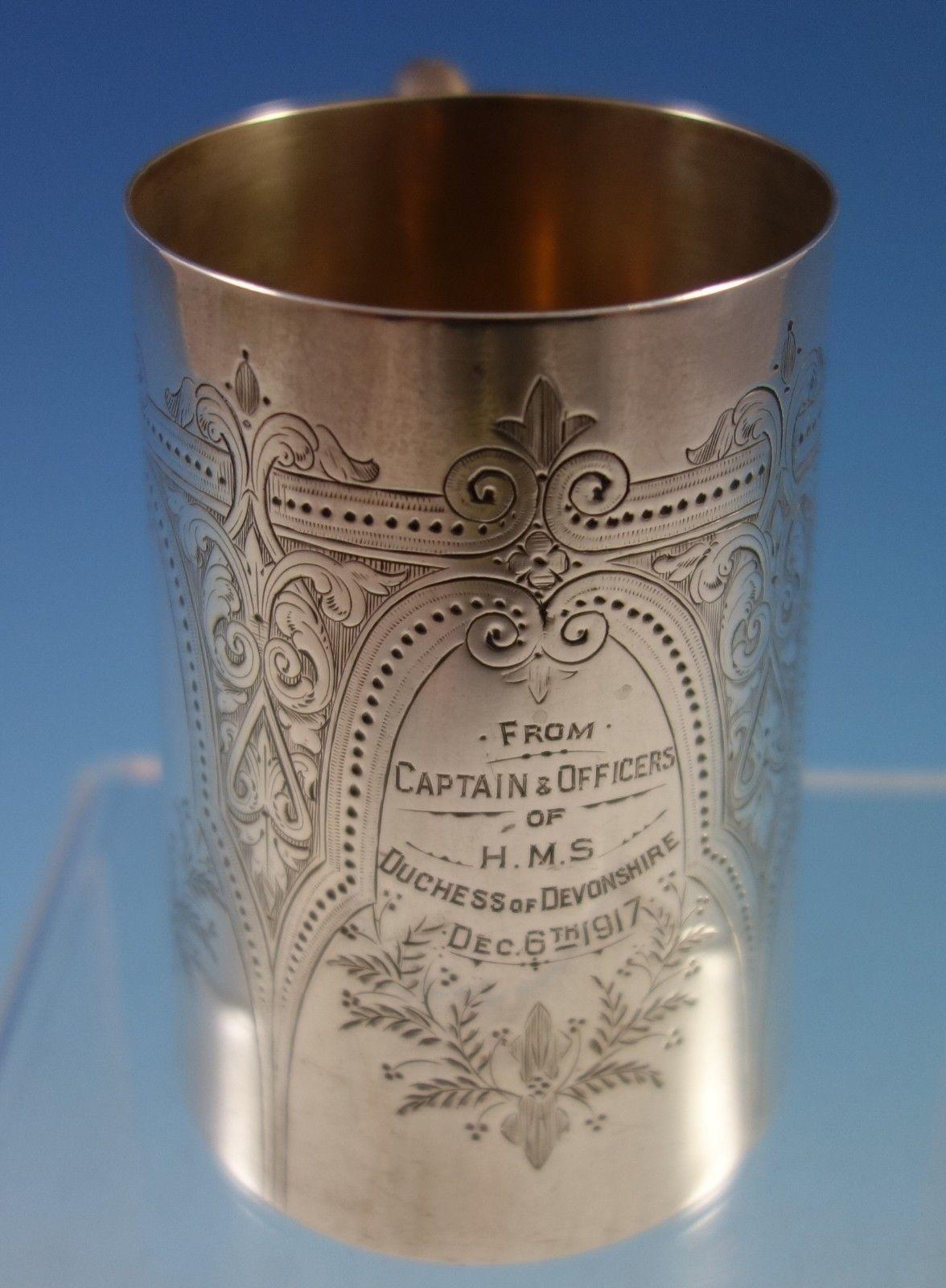 English sterling silver baby cup made by Edward Charles Brown London in 1914. The cup is bright-cut and chased with an inscription that reads, From Captain and Officers of HMS Duchess of Devonshire Dec. 6th 1917. The piece is marked with #4020 and