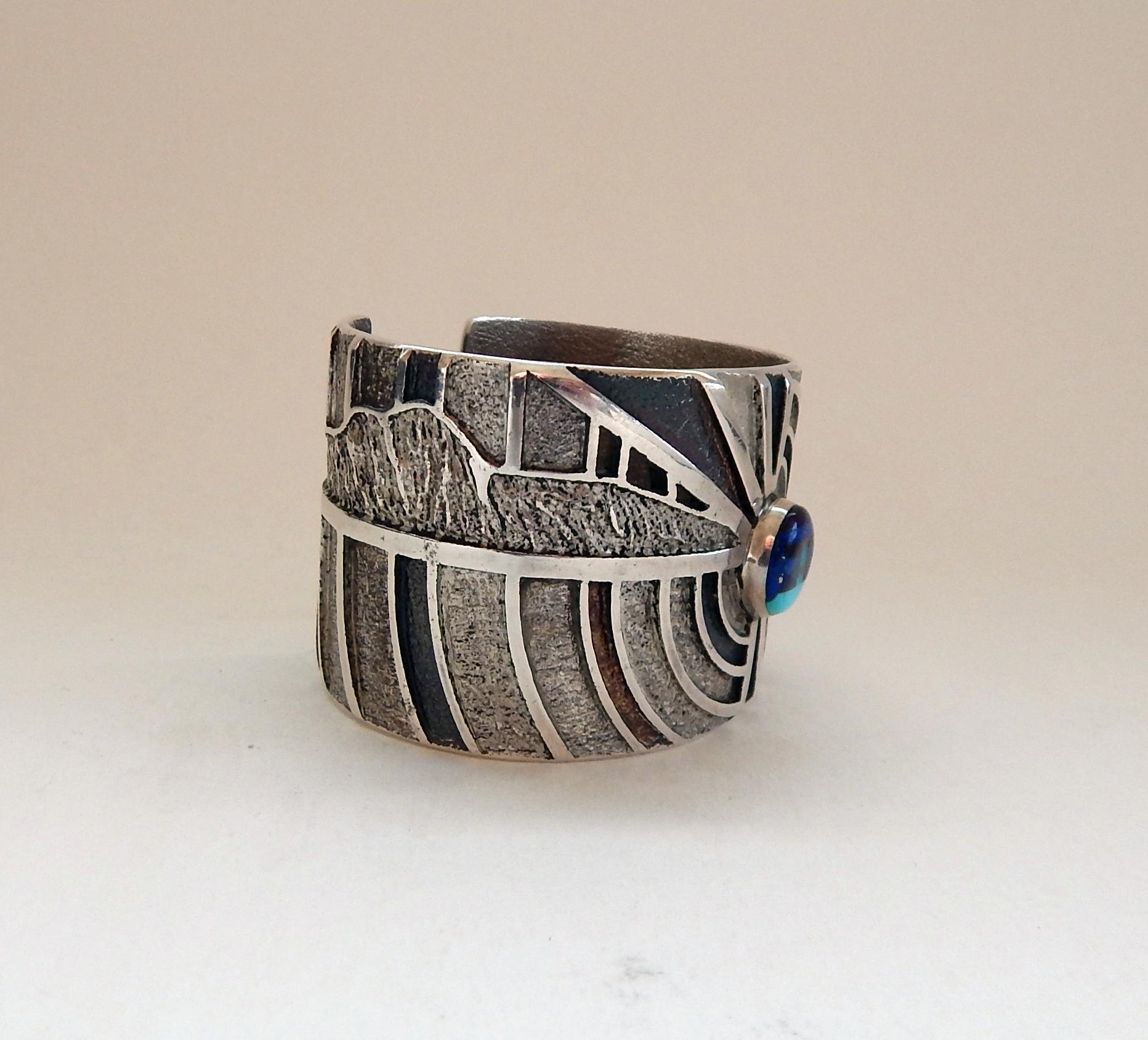 Navajo artist Ed Charlie (Ric's Brother)
Sterling cuff bracelet with sunface inlay of lapis and turquoise.
Measurements: Outside: 2-1/8