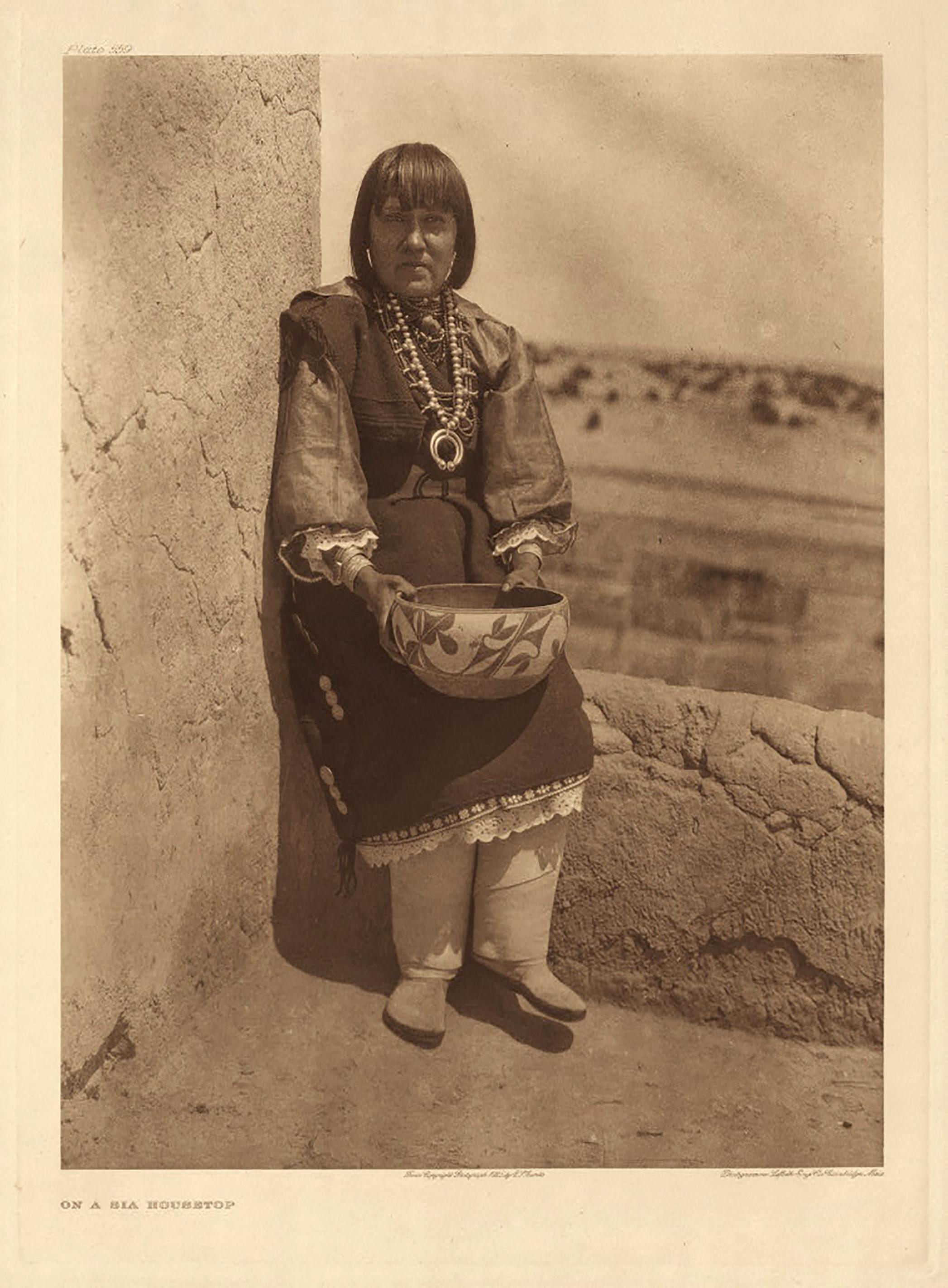 Edward Curtis, On a Sia Housetop, Plate 559, from Portfolio 16, Photogravure on Japan Vellum. Image Size: 18.25 x 13.75".

Born in 1868 near Whitewater, Wisconsin, Edward Sheriff Curtis became one of America’s finest photographers and ethnologists.