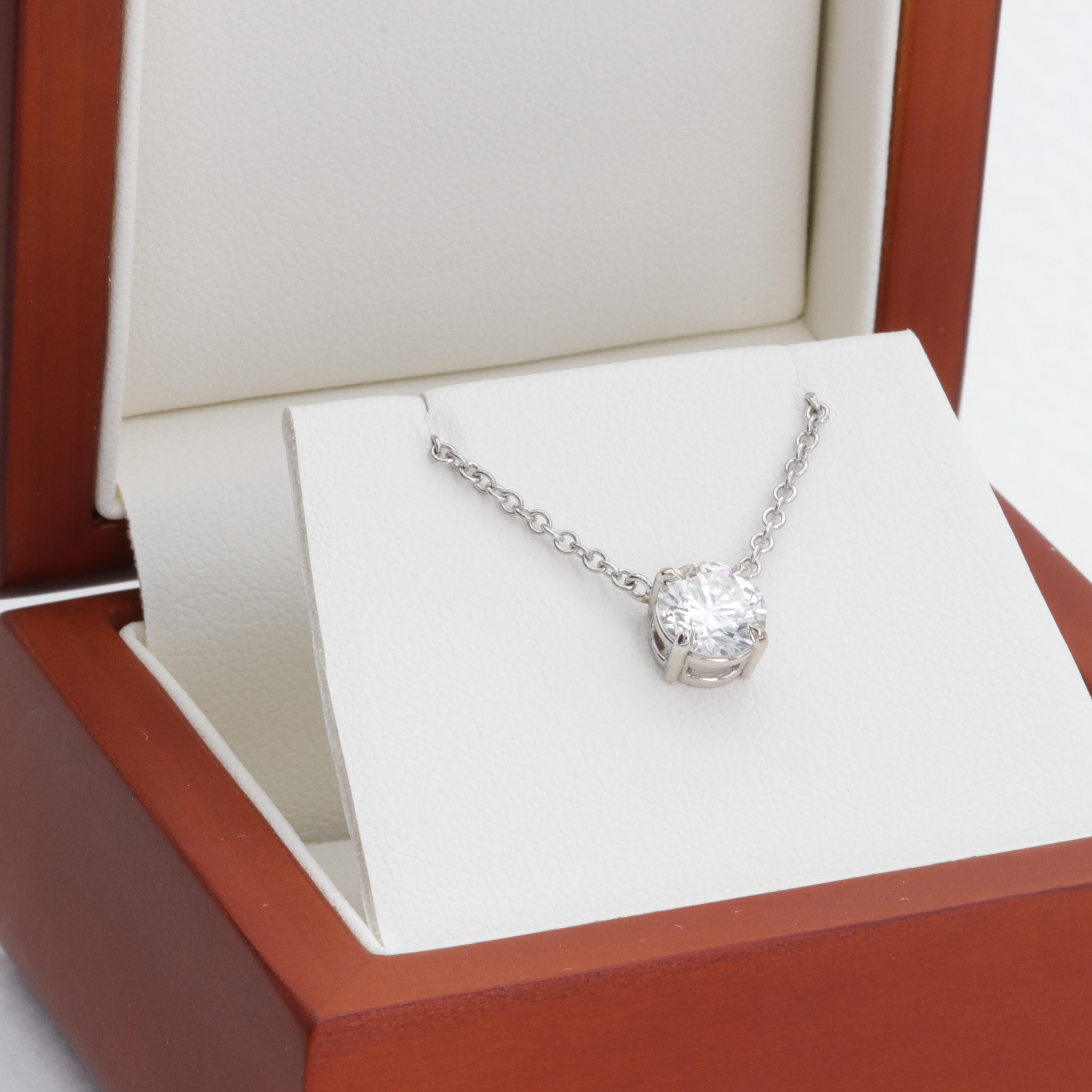 This new and finely made solitaire pendant necklace features a 1.11 carat J color VS1 clarity round brilliant cut natural diamond accompanied by an original GIA report. 

The diamond has a bright face up appearance with a very clean VS1 clarity that