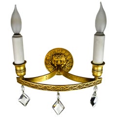 Edward F. Caldwell Brass Sconce with Wind God Design