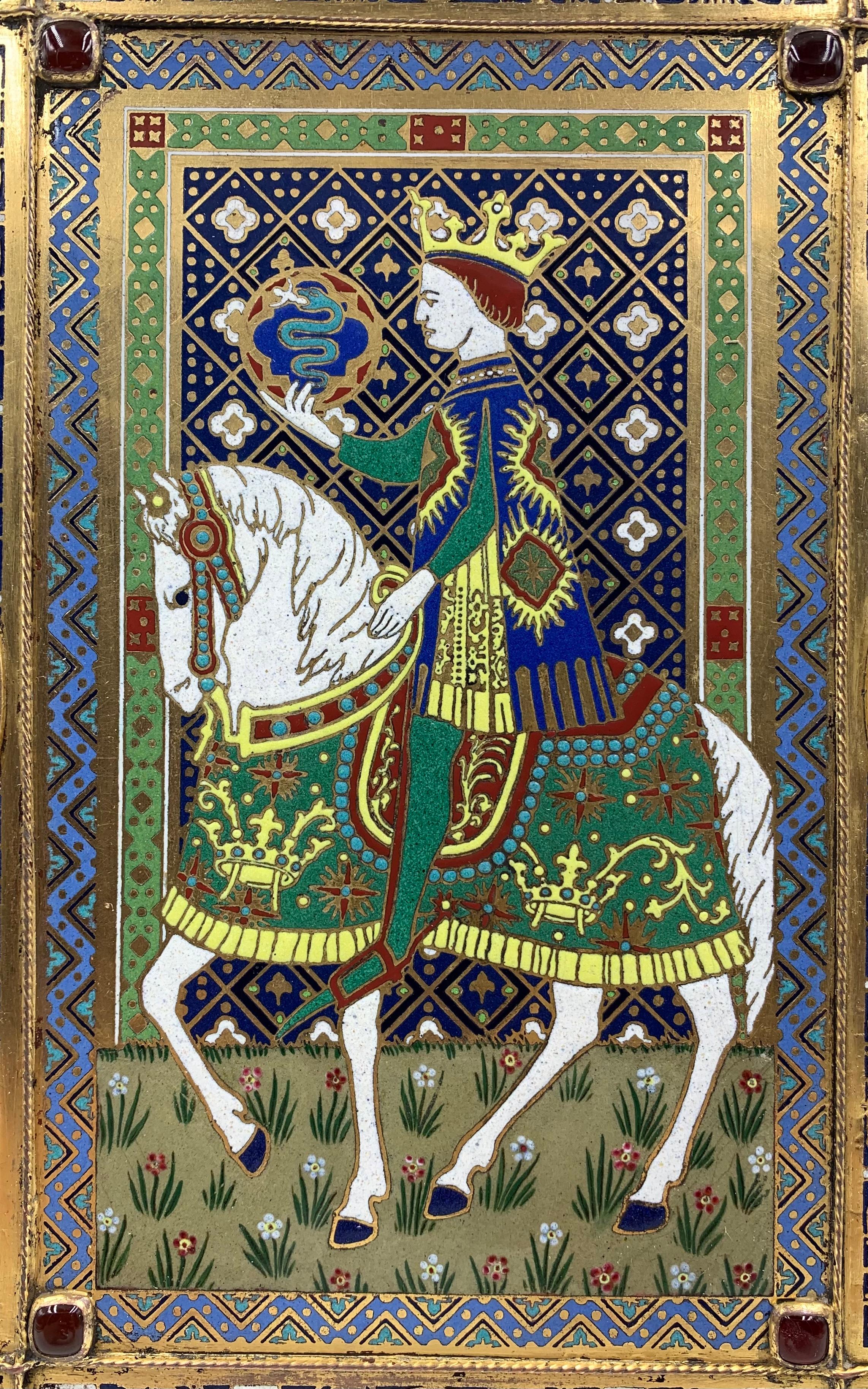 A very rare, fine large Edward F. Caldwell jeweled champleve enamel folio cover in the High Gothic Style. The central panel depicting a King on a white horse holding a large orb with a snake symbol, surrounded by exquisitely detailed Gothic heraldic