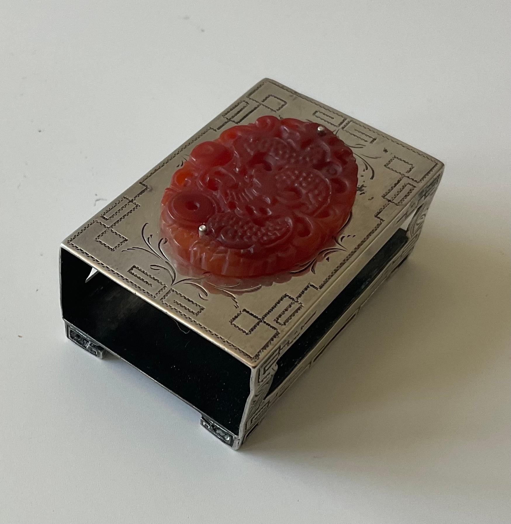 Edward Farmer New York Sterling and dragon carnelian art deco matchbox cover Signed as shown. We believe the original stone to be Carnelian, but are not gemologists. The carving of a dragon in the stone is extremely well done. Sterling detail is