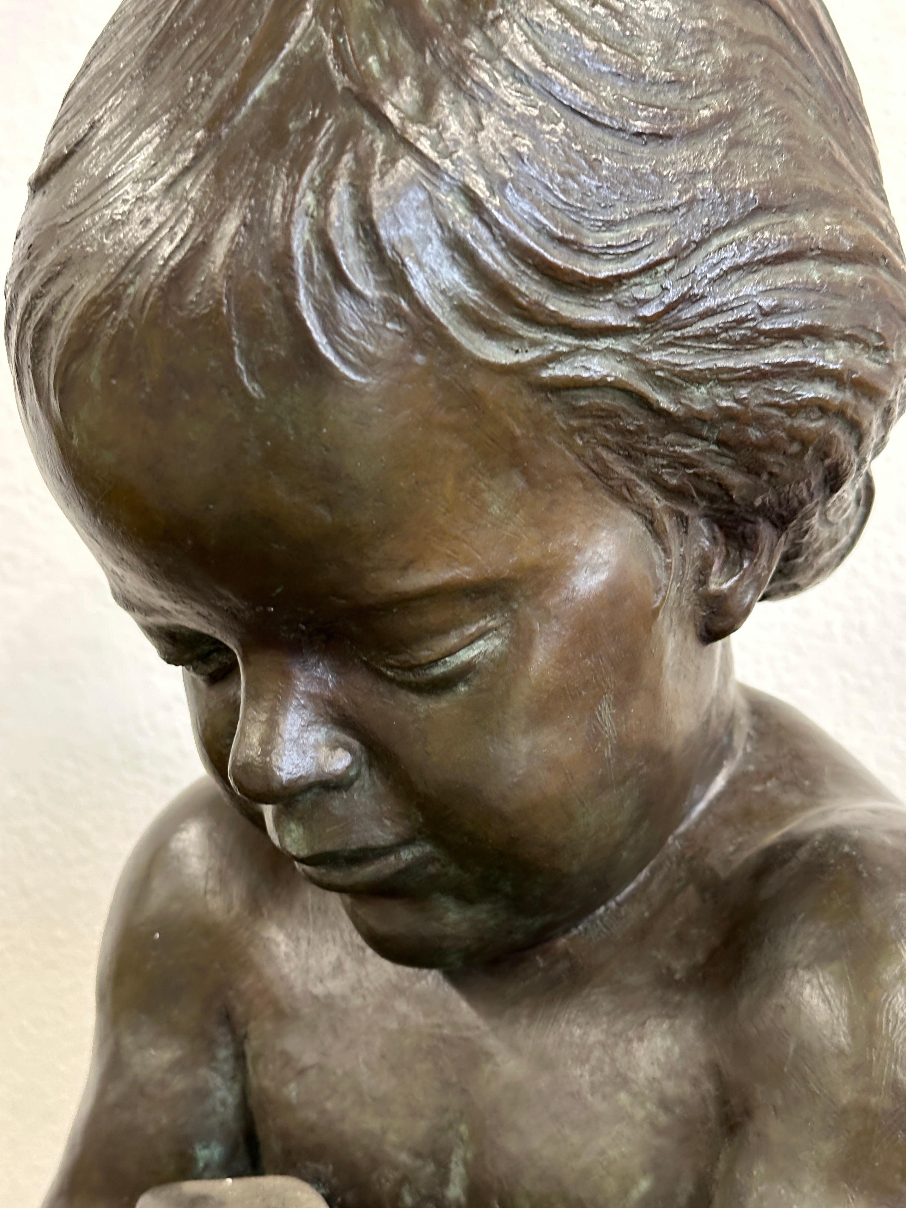 A wonderful and extremely detailed bronze of a girl holding a bunny by the noted American Artist Edward Fenno Hoffman III. It is signed and dated 1977 and also numbered 4/10. It is pictured on the title page of mr Hoffman's book as works on the
