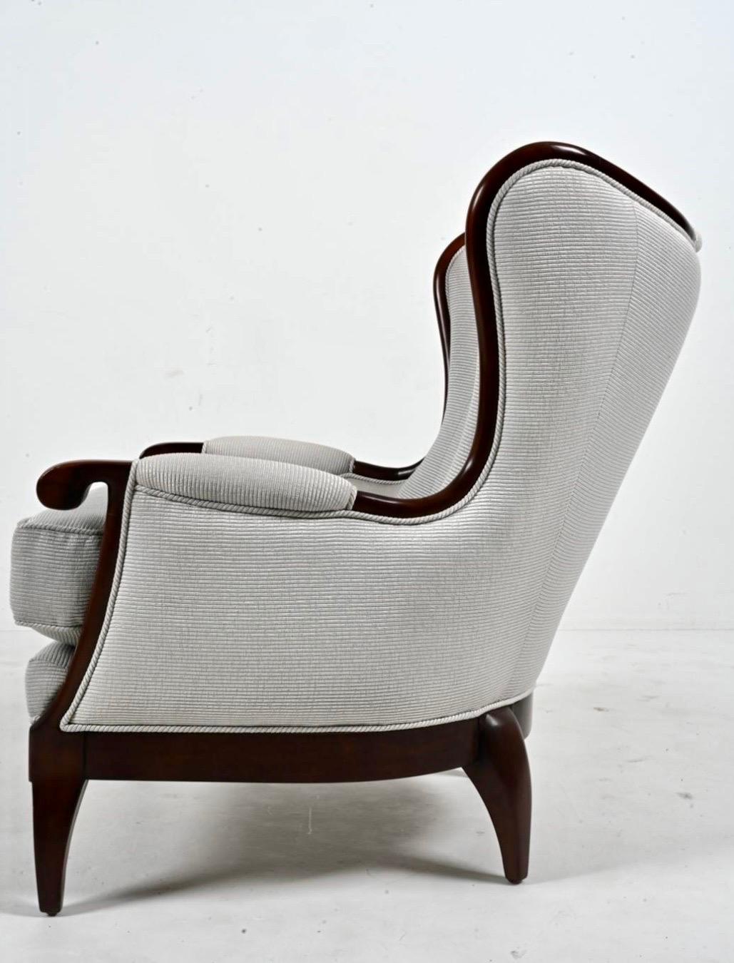 Ferrell wingback in modern silohette and exposed mahogany frame in ribbed silver fabric.