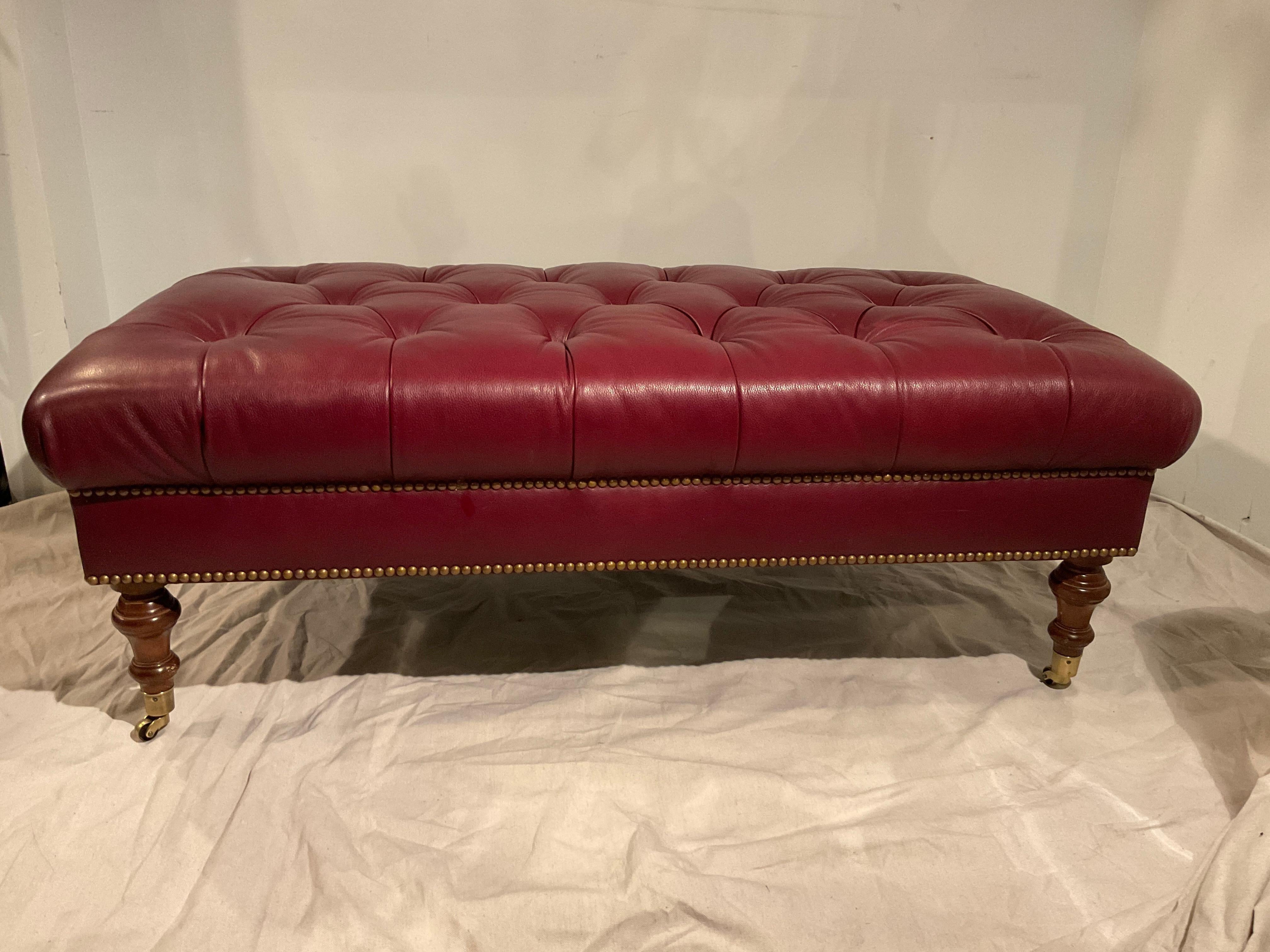 Edward Ferrell Tufted Red Leather Ottoman On Brass Casters In Good Condition For Sale In Tarrytown, NY