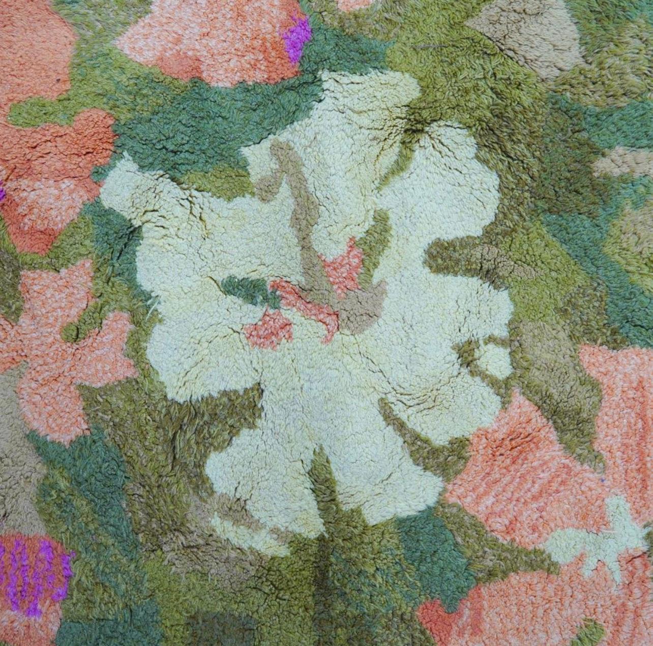 Edward Fields all wool designer rug with floral green, pink and off white pattern.

USA, circa 1960. Signed Edward Fields. 

Measures approximately 9 feet x 9 feet. 

Exact Dimensions: 109