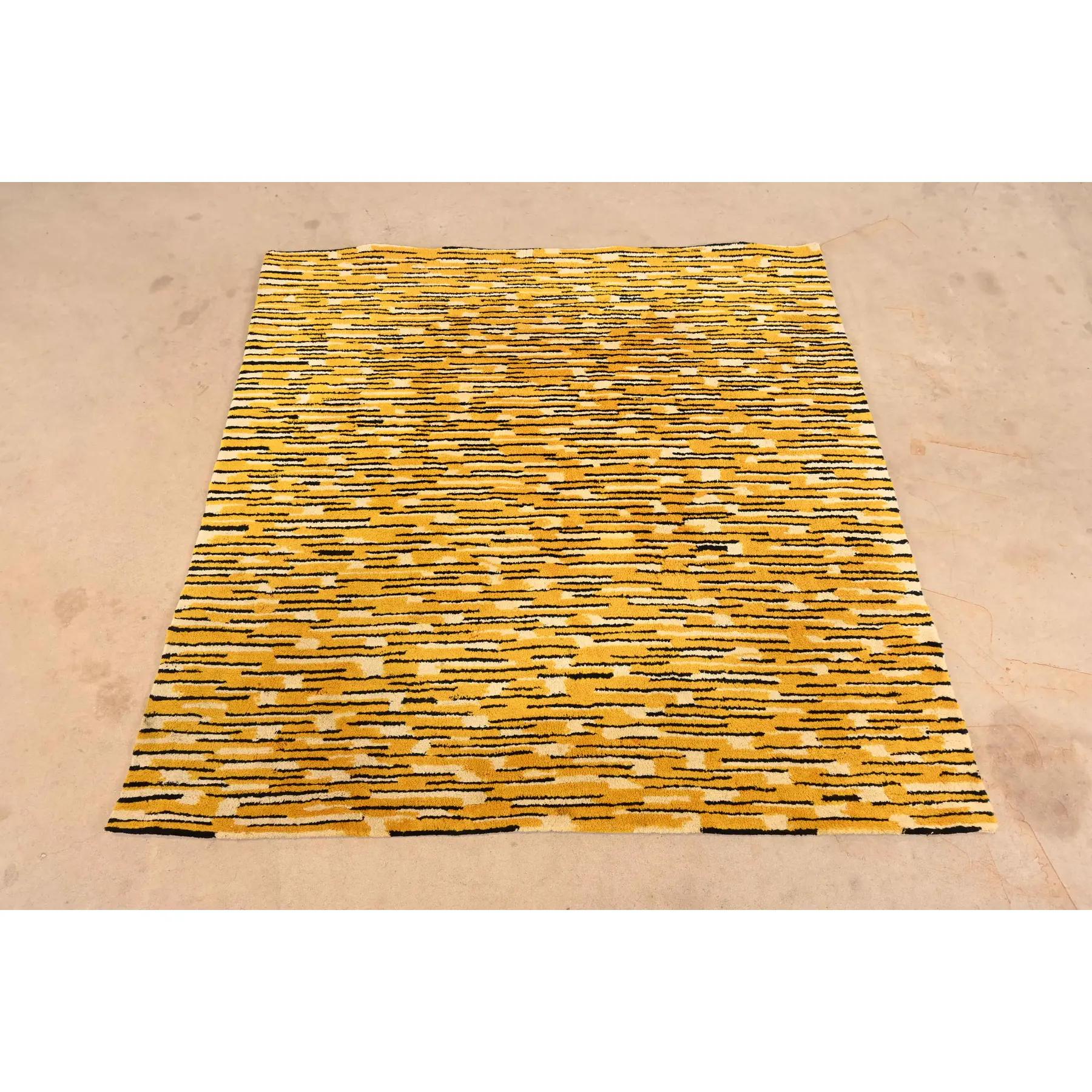 A gorgeous Mid-Century Modern abstract square room size designer wool rug

By Edward Fields

USA, 1965

Thick wool pile, with predominant colors in yellow, black, and ivory.

Measures: 6'6