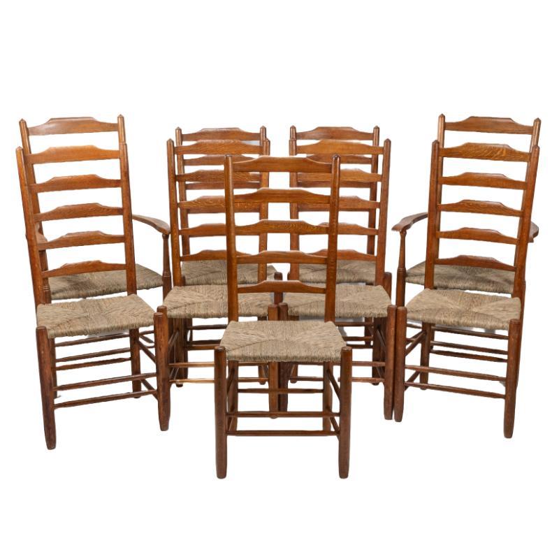 Edward Gardiner
Set of nine English ladder-back dining chairs. Chairs made by Edward Gardiner are rarely signed, but every chair in this set is signed E. D. Gardiner (see sample images attached). It is extremely rare to find a set of nine, let alone